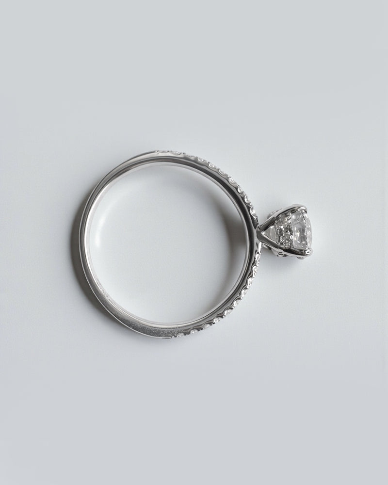 Round brilliant lab grown diamond ring with pavé diamond shoulders, luxury engagement ring