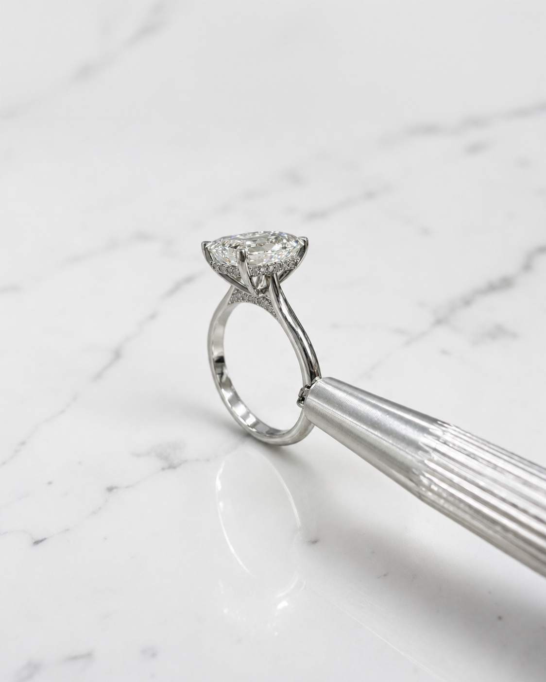 2.50ct emerald cut lab grown diamond cathedral engagement ring with diamond hidden halo, diamond bridge and polished band, handmade in London.