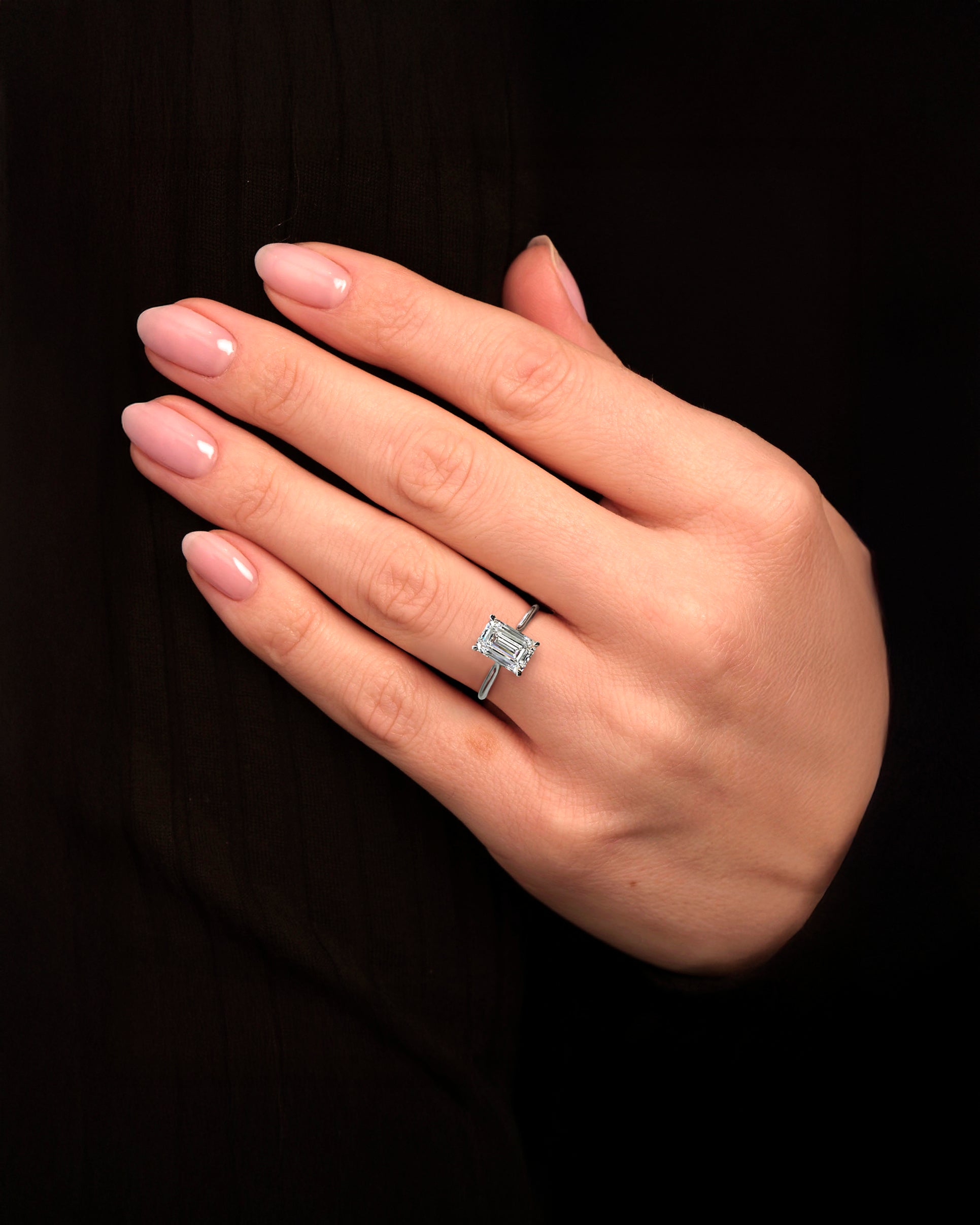 2.50ct Emerald cut lab grown diamond plain band solitaire cathedral style, diamond hidden halo and bridge engagement ring on hand