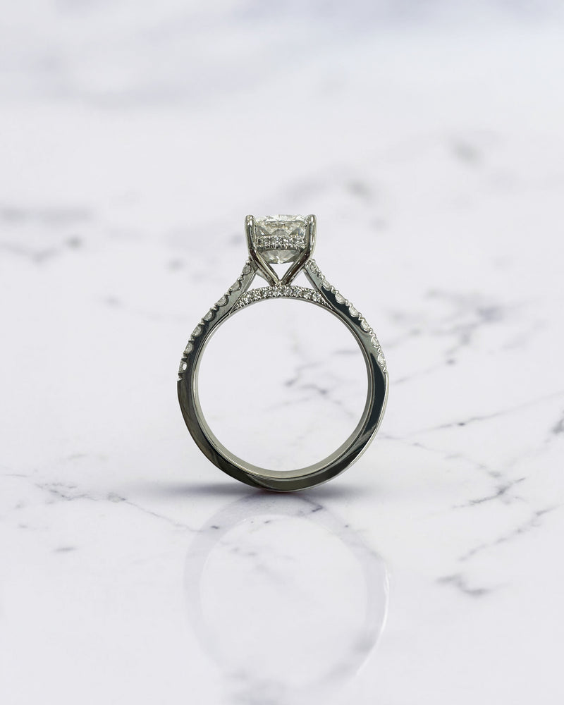 2ct elongated cushion cut lab grown diamond engagement ring with cathedral setting, hidden halo, diamond bridge and diamond shoulder band.