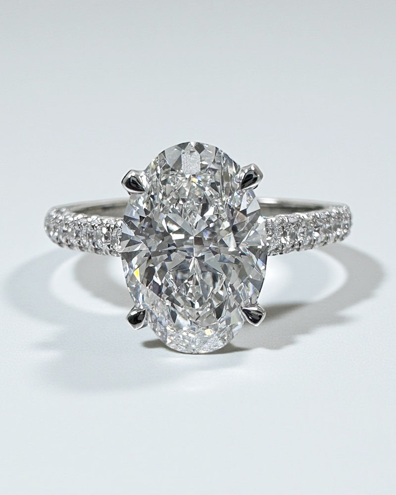 2ct oval cut lab grown diamond set in a cathedral 3d diamond band engagement ring, platinum 18kt gold, hidden halo, made in London, Layla Diamonds