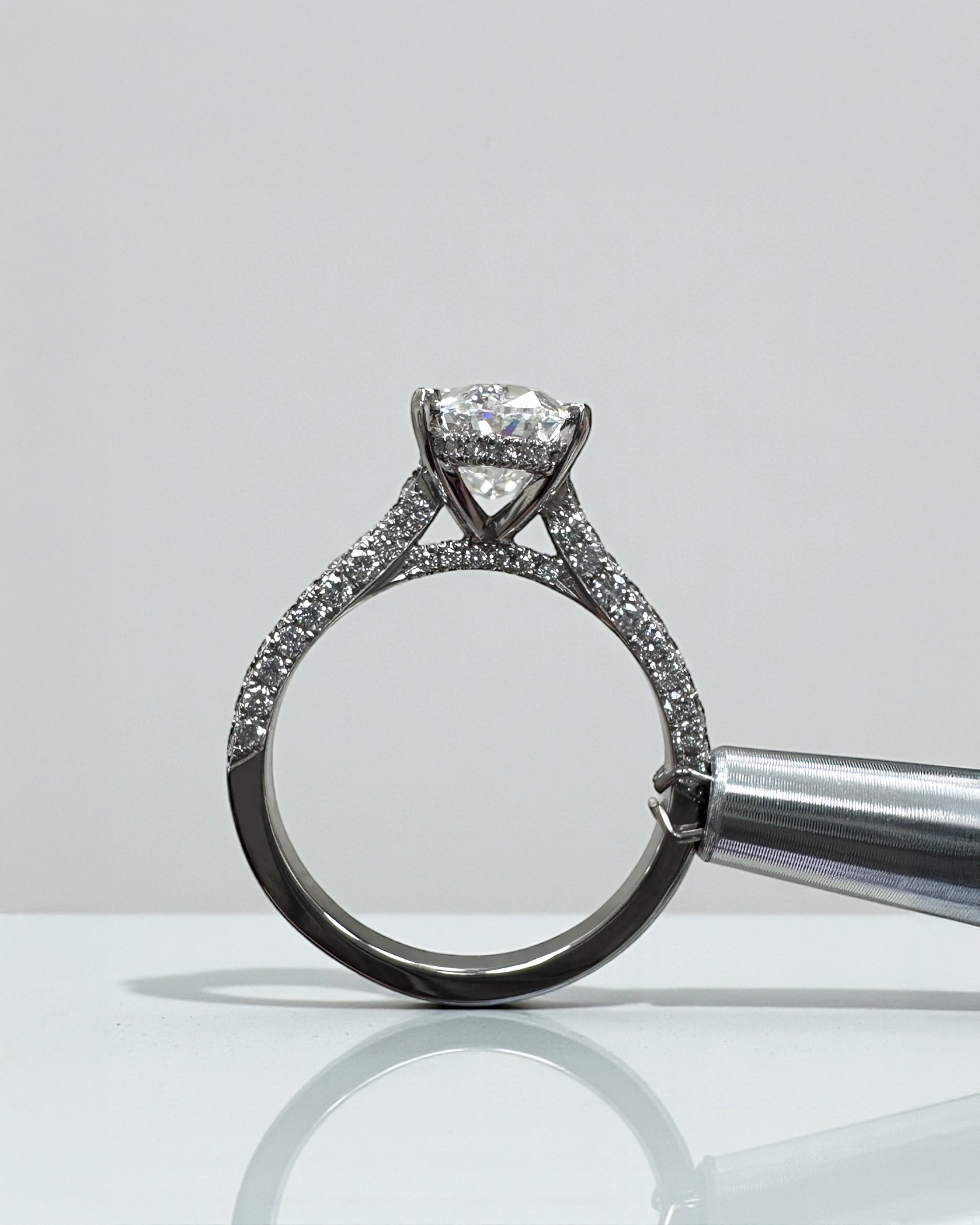 2ct oval cut lab grown diamond set in a cathedral 3d diamond band engagement ring, platinum 18kt gold, hidden halo, made in London, Layla Diamonds