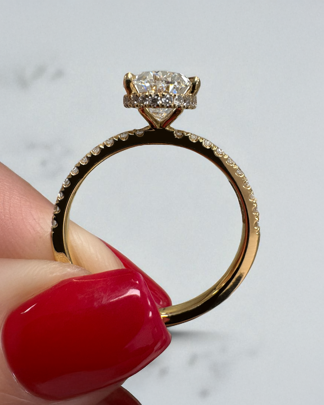 2ct lab grown oval cut diamond hidden halo shoulder band, 18kt yellow gold