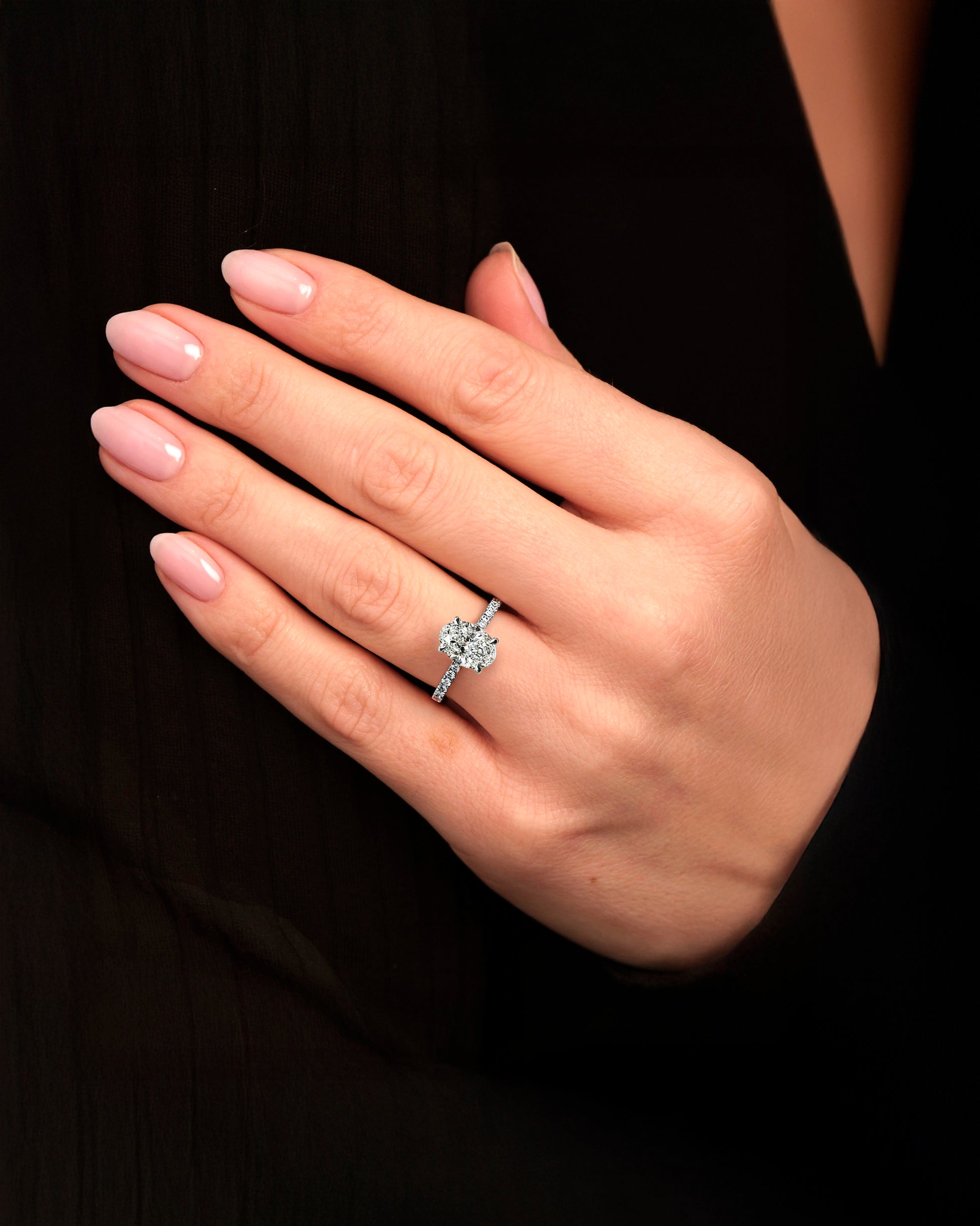 2ct oval diamond engagement ring on hand 