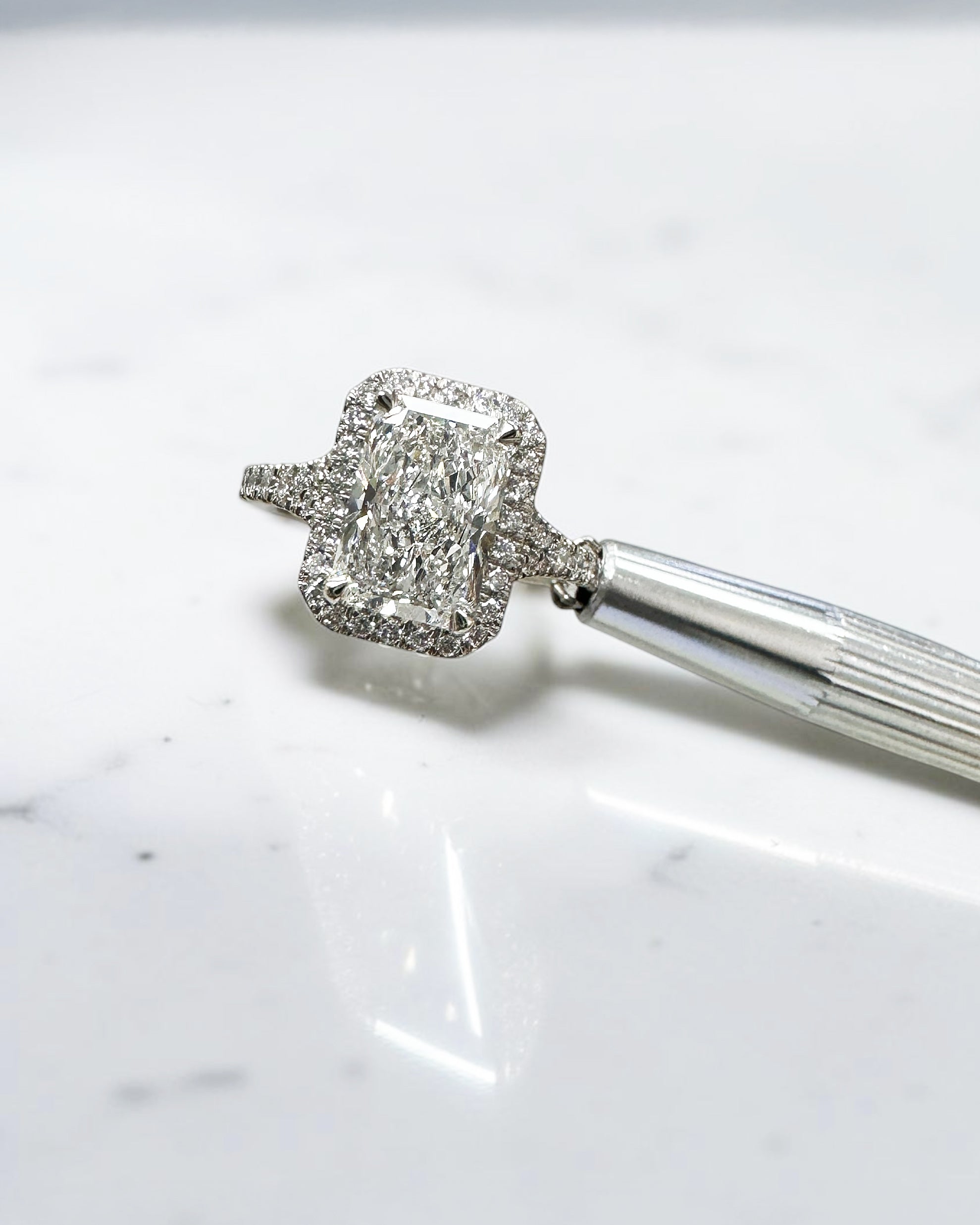 2ct radiant cut lab grown diamond halo engagement ring with diamond split shank band, approximately 2.42ct total diamond weight, handcrafted in platinum or 18kt gold by Layla Diamonds.