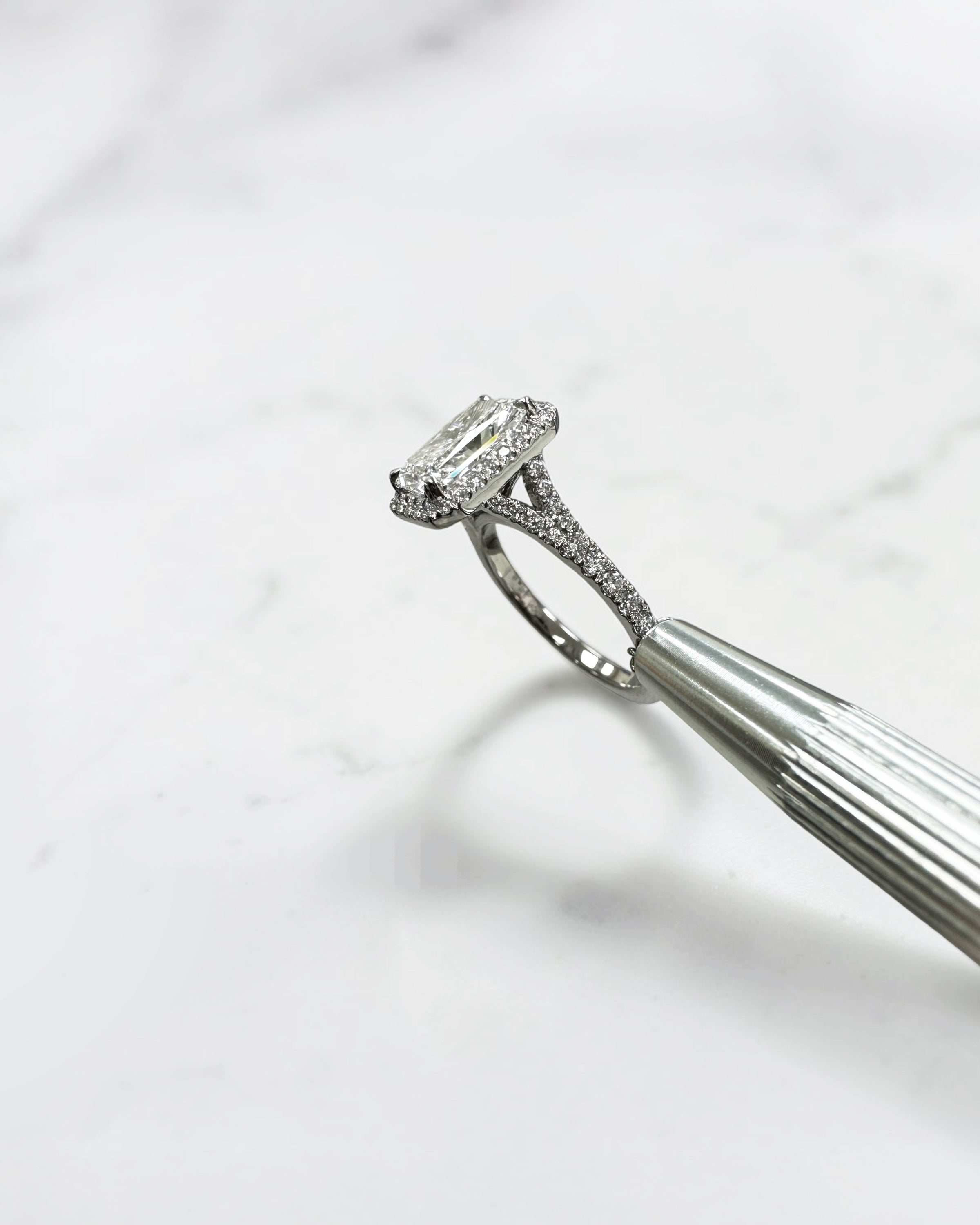 2ct radiant cut lab grown diamond halo engagement ring with diamond split shank band, approximately 2.42ct total diamond weight, handcrafted in platinum or 18kt gold by Layla Diamonds.