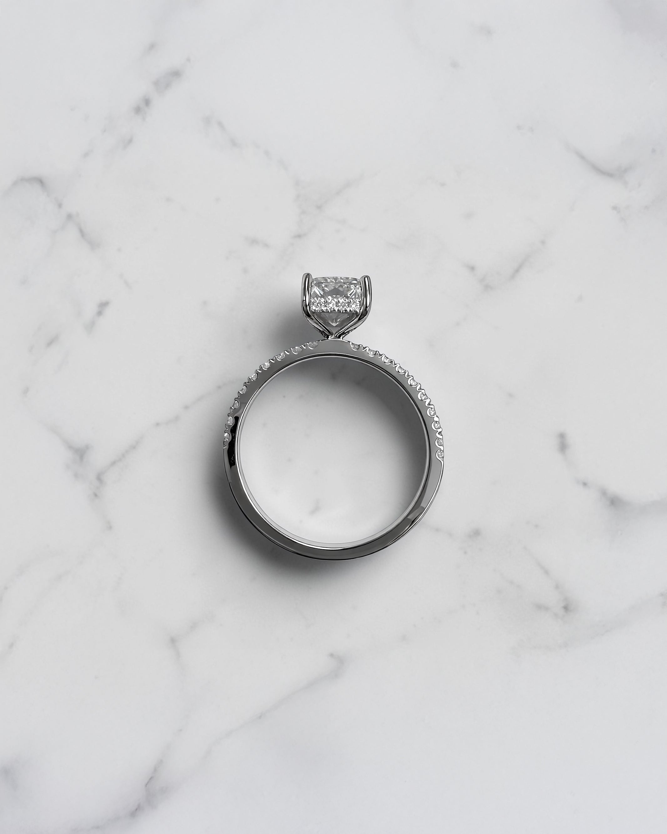 Lab grown 2ct radiant cut diamond engagement ring with hidden halo and pavé diamond shoulders platinum 18kt white gold