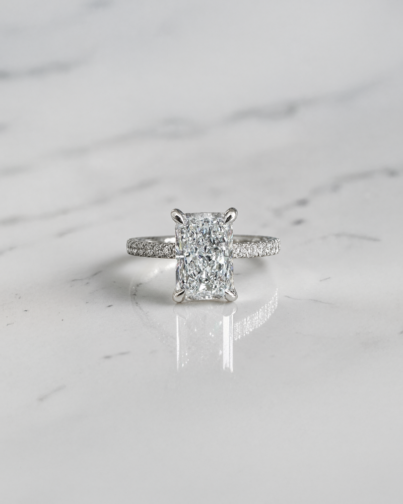 2ct radiant cut lab grown diamond engagement ring with open diamond set prongs and pavé diamond band in white gold, total 2.34ct