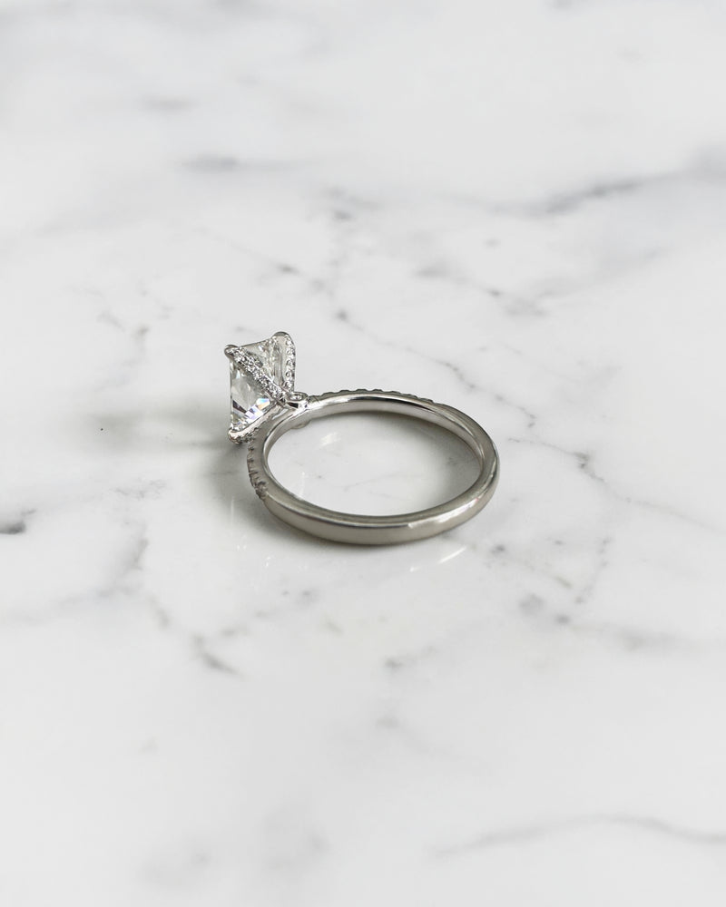 2ct radiant cut lab grown diamond engagement ring with open diamond set prongs and pavé diamond band in white gold, total 2.34ct