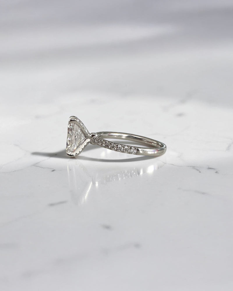 2ct radiant cut lab grown diamond engagement ring with open diamond set prongs and pavé diamond band in white gold, total 2.34ct