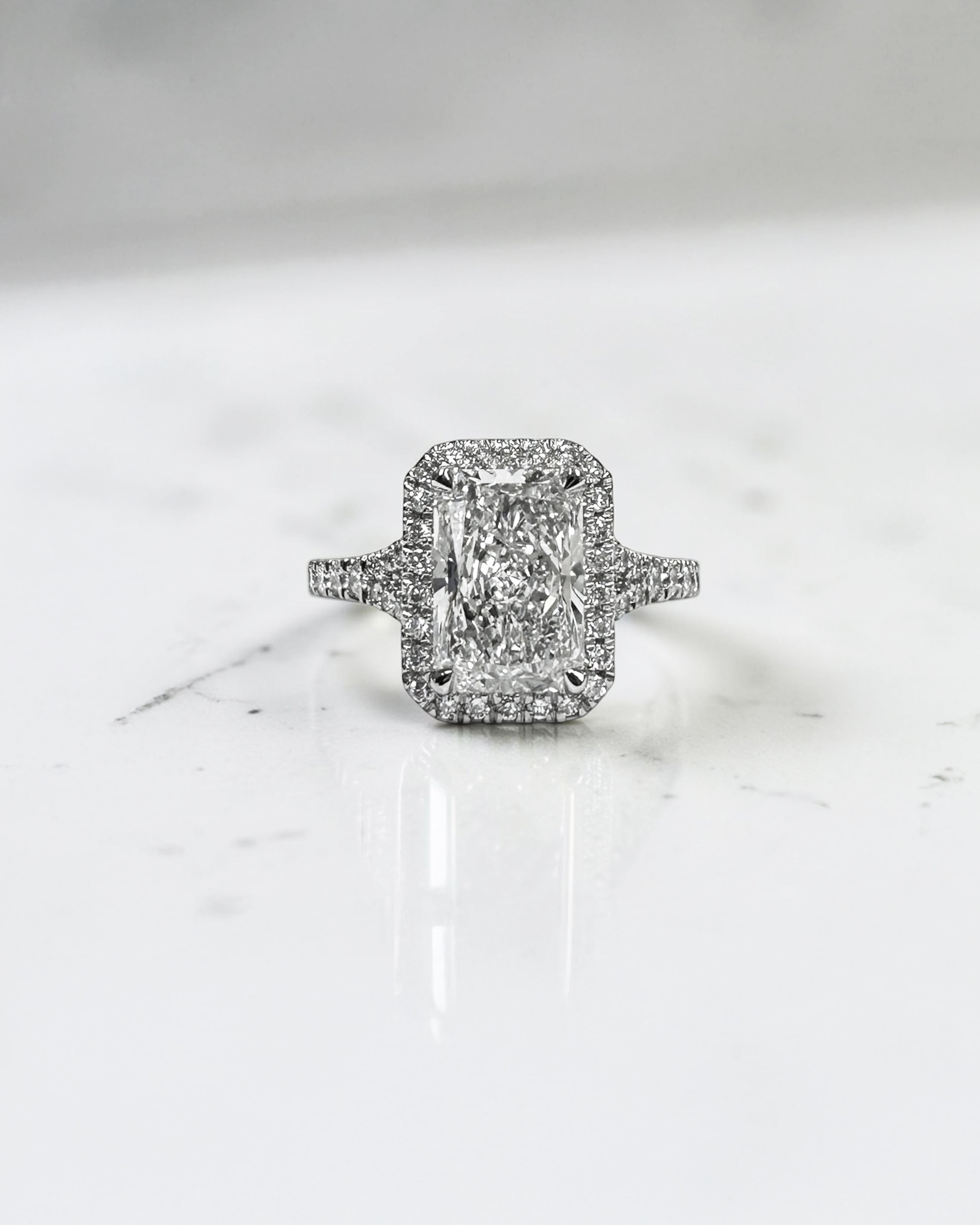 2ct radiant cut lab grown diamond halo engagement ring with diamond split shank band, approximately 2.42ct total diamond weight, handcrafted in platinum or 18kt gold by Layla Diamonds.