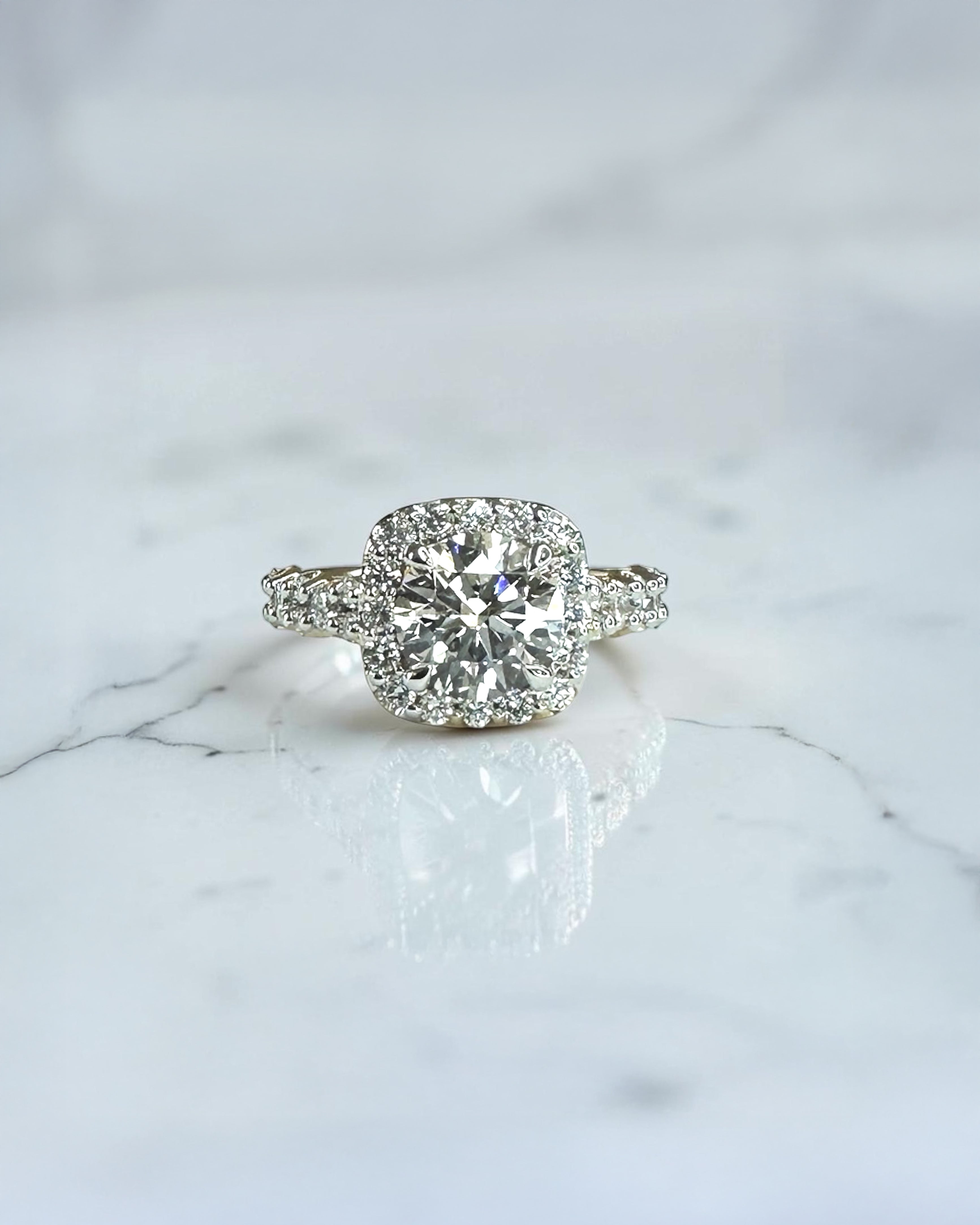 2ct round halo lab grown diamond engagement ring with diamond halo, fancy diamond shoulders and 3ct total diamond weight in 9ct yellow or white gold.
