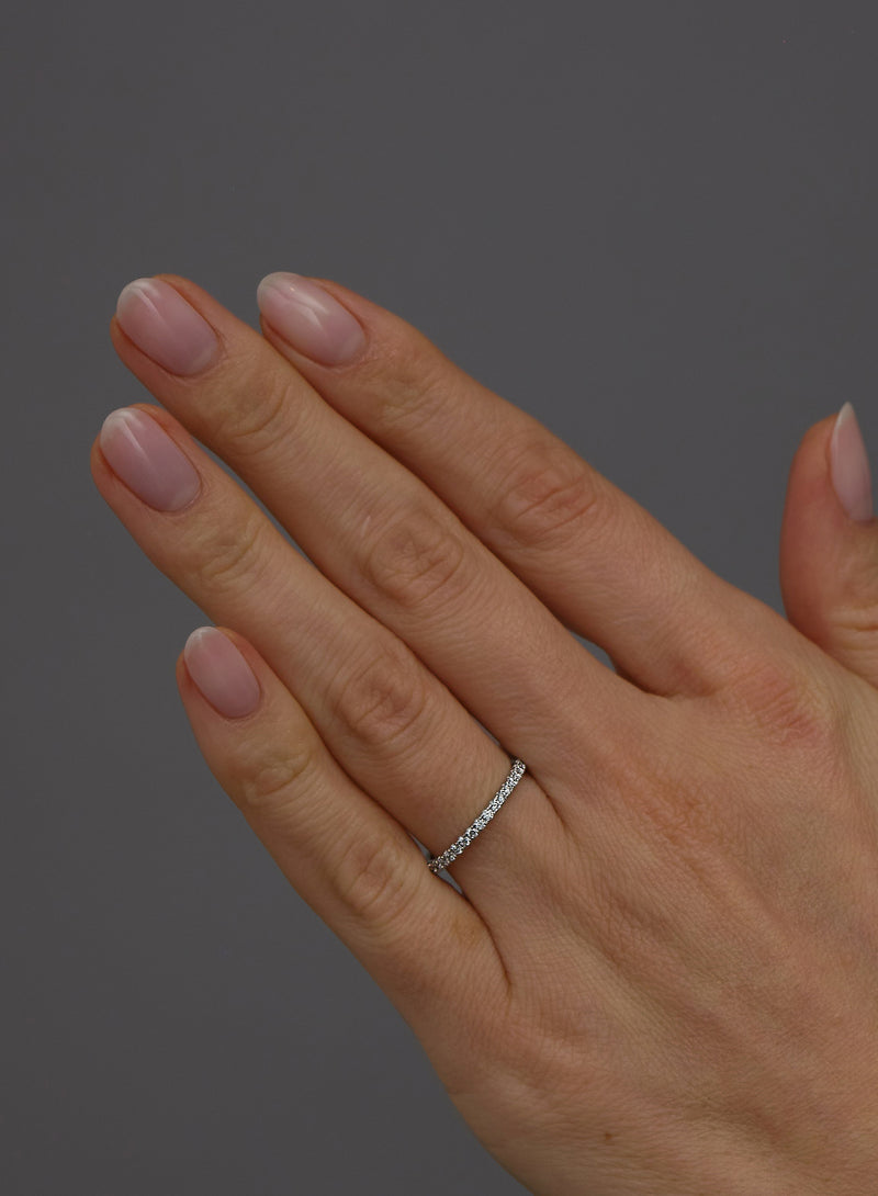 Close-up detail of the round diamonds on this 2mm women's diamond engagement band.