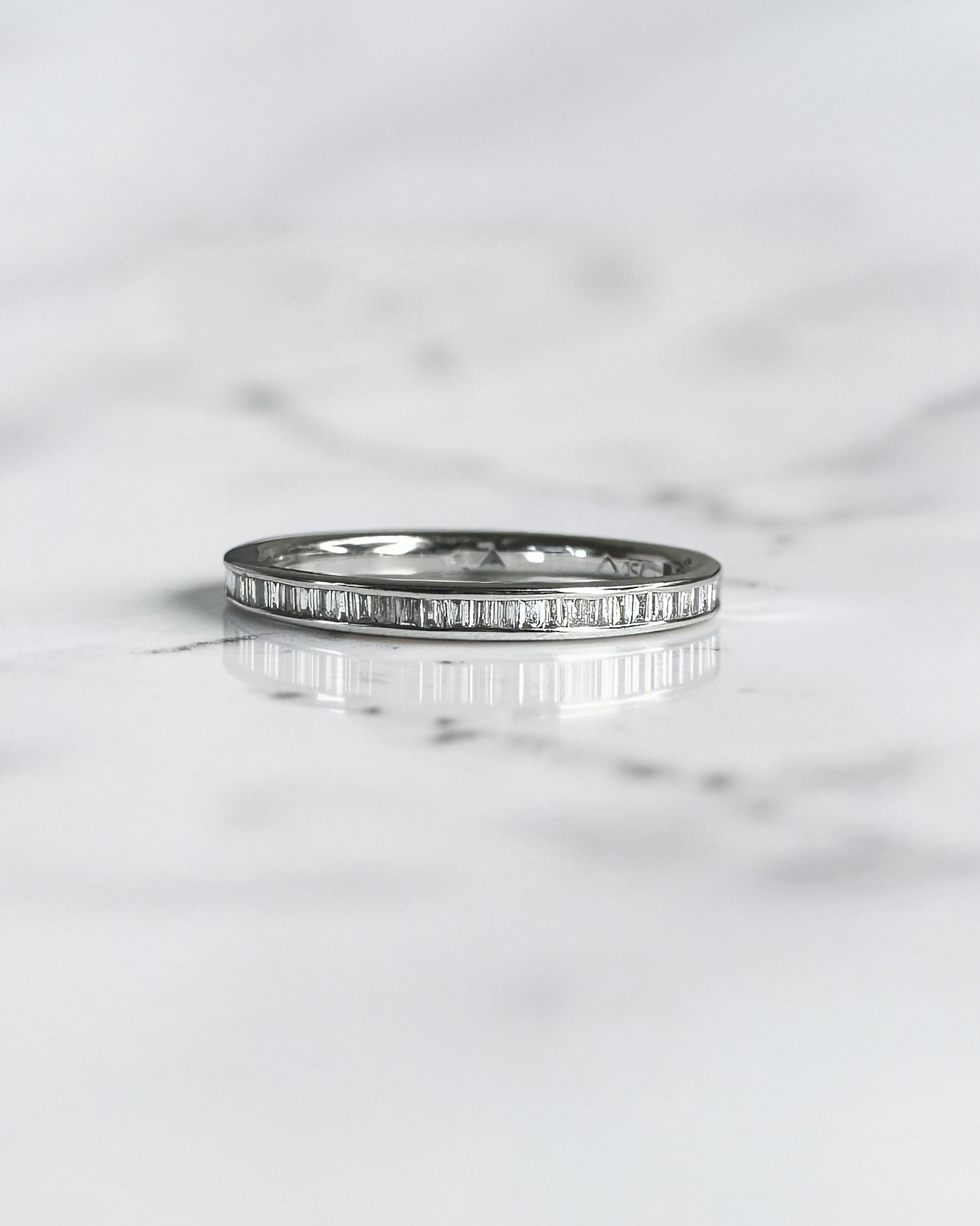 Half set channel set round brilliant diamond wedding band in 18ct yellow gold, white gold or platinum, available with lab grown or natural diamonds.
