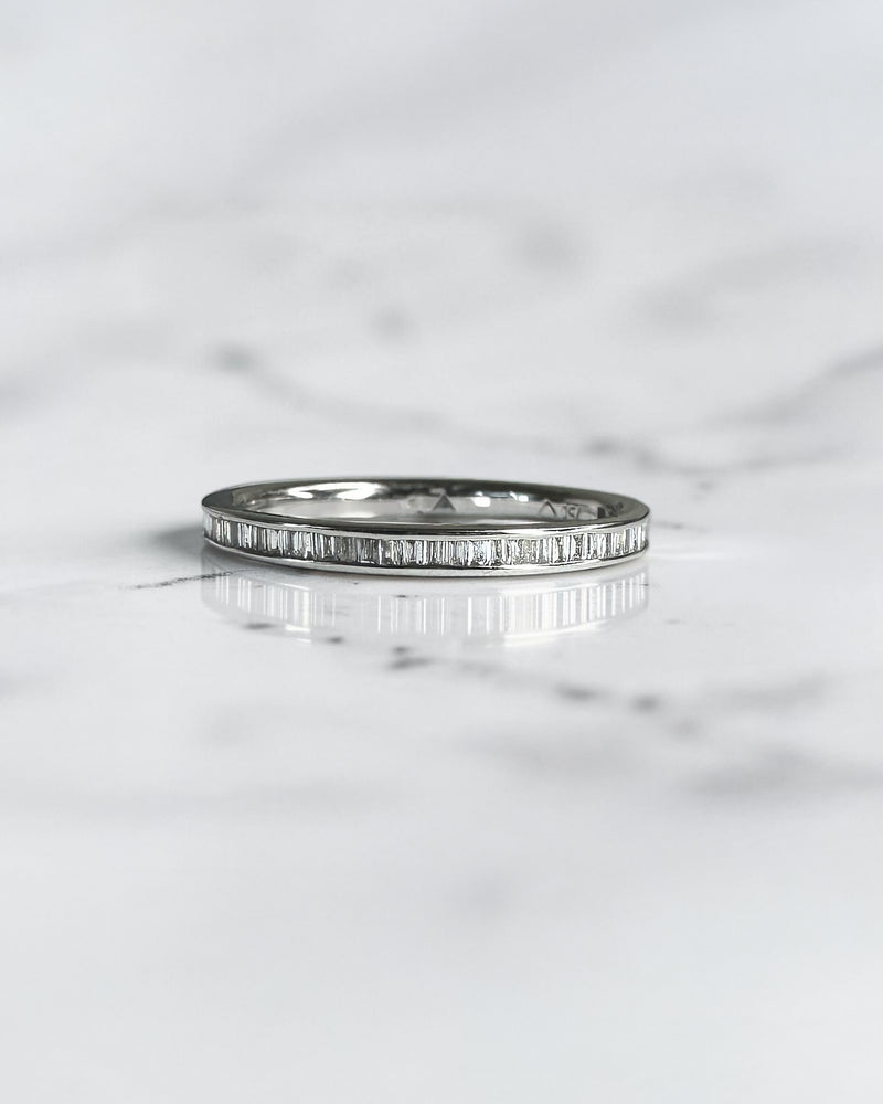 Half set channel set round brilliant diamond wedding band in 18ct yellow gold, white gold or platinum, available with lab grown or natural diamonds.