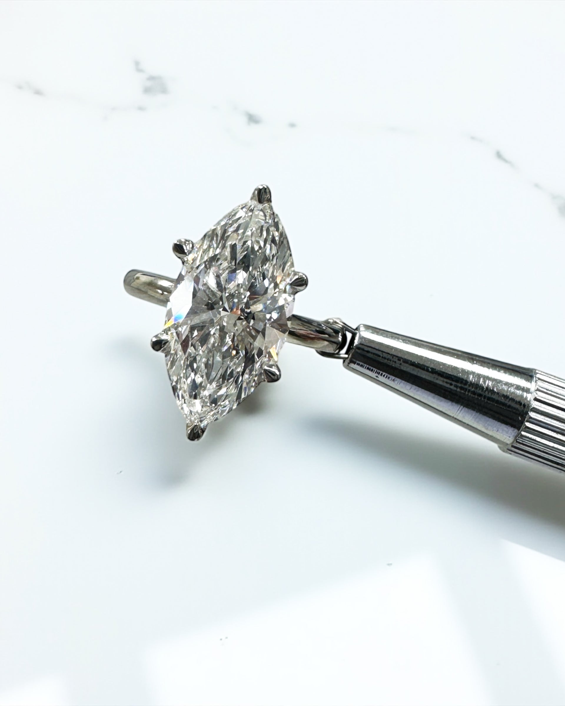 3.50ct marquise cut lab grown diamond engagement ring with hidden halo and floating head in plain band, handcrafted in London by Layla Diamonds, in platinum