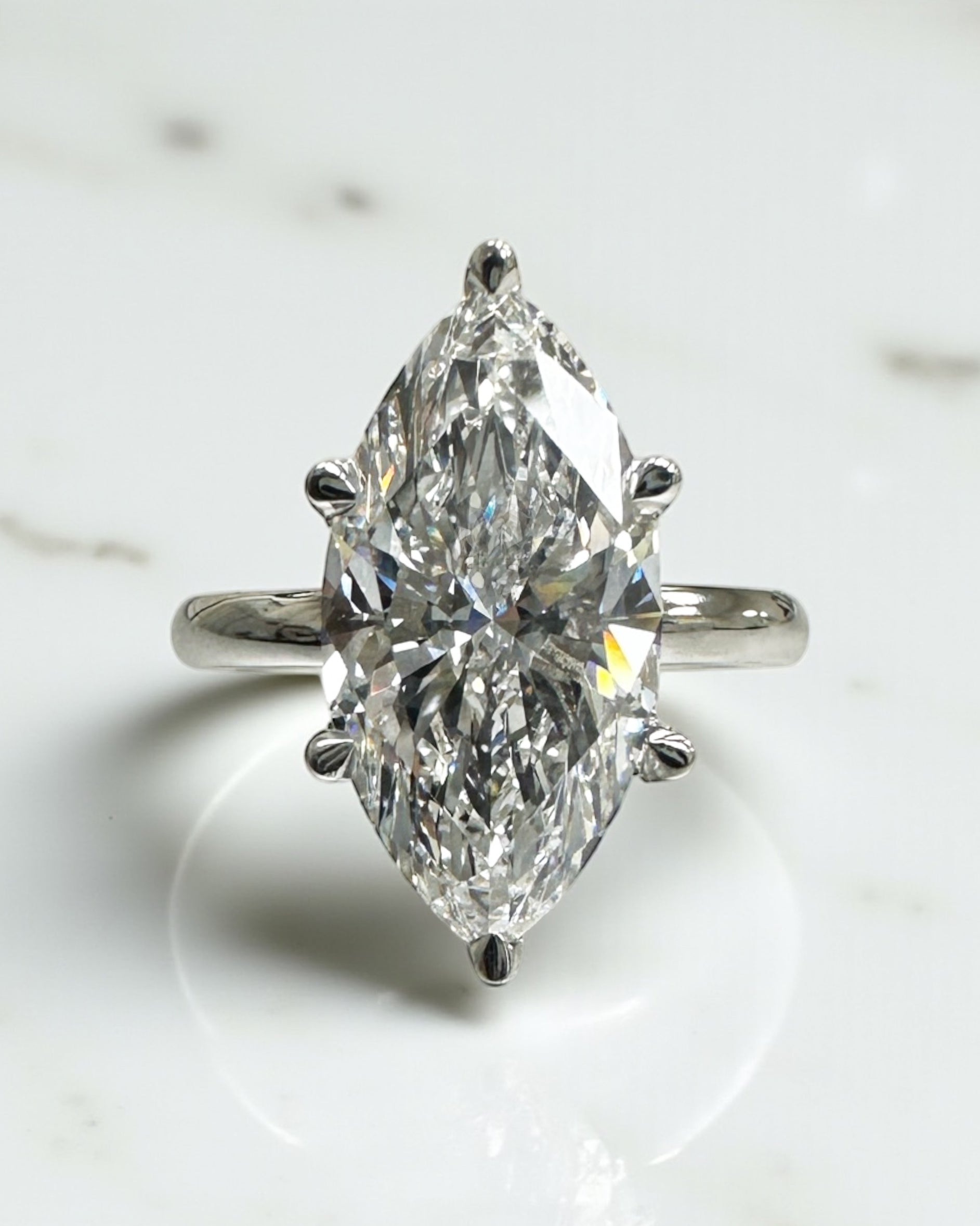 3.50ct marquise cut lab grown diamond engagement ring with hidden halo and floating head in plain band, handcrafted in London by Layla Diamonds, in platinum