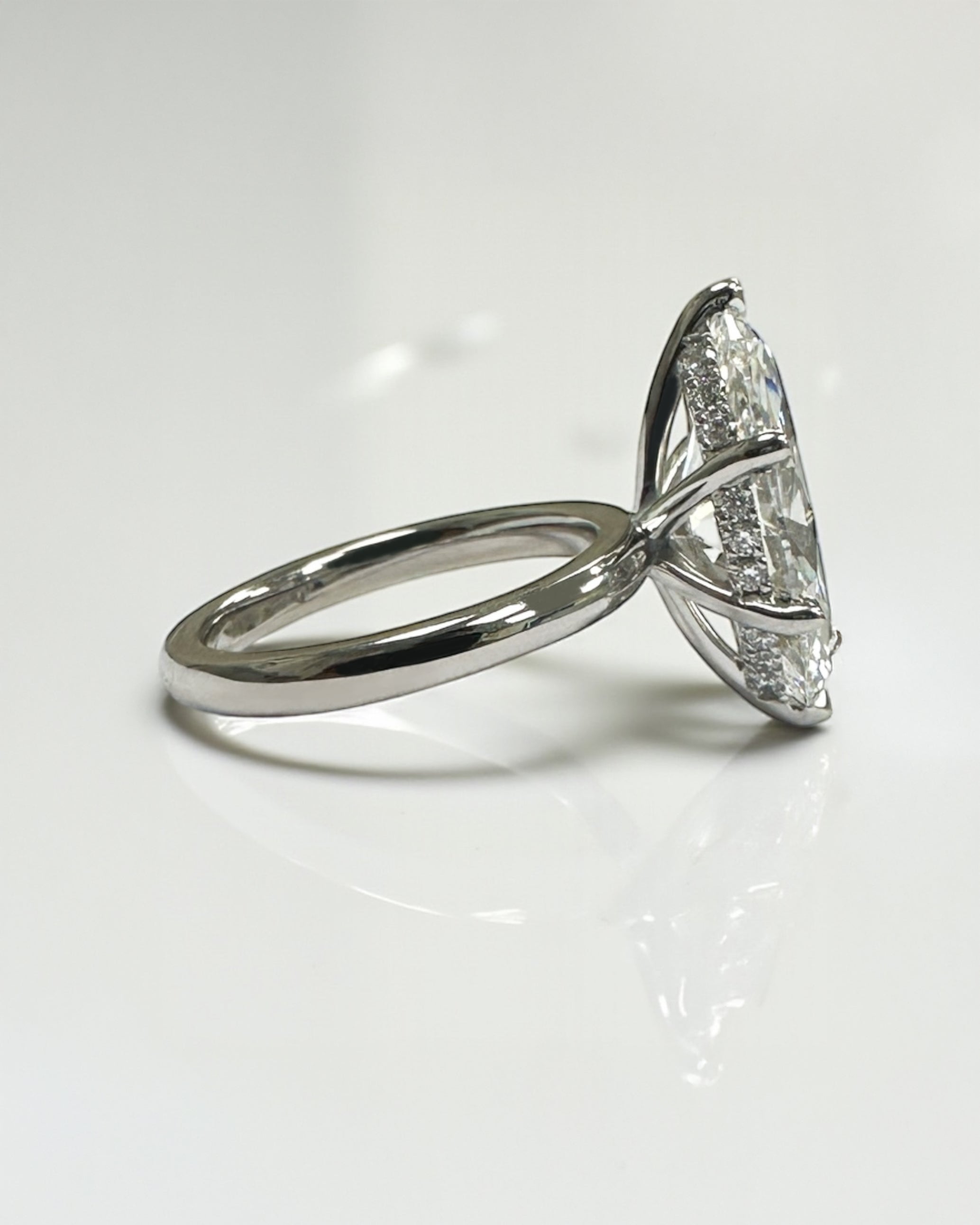 3.50ct marquise cut lab grown diamond engagement ring with hidden halo and floating head in plain band, handcrafted in London by Layla Diamonds, in platinum