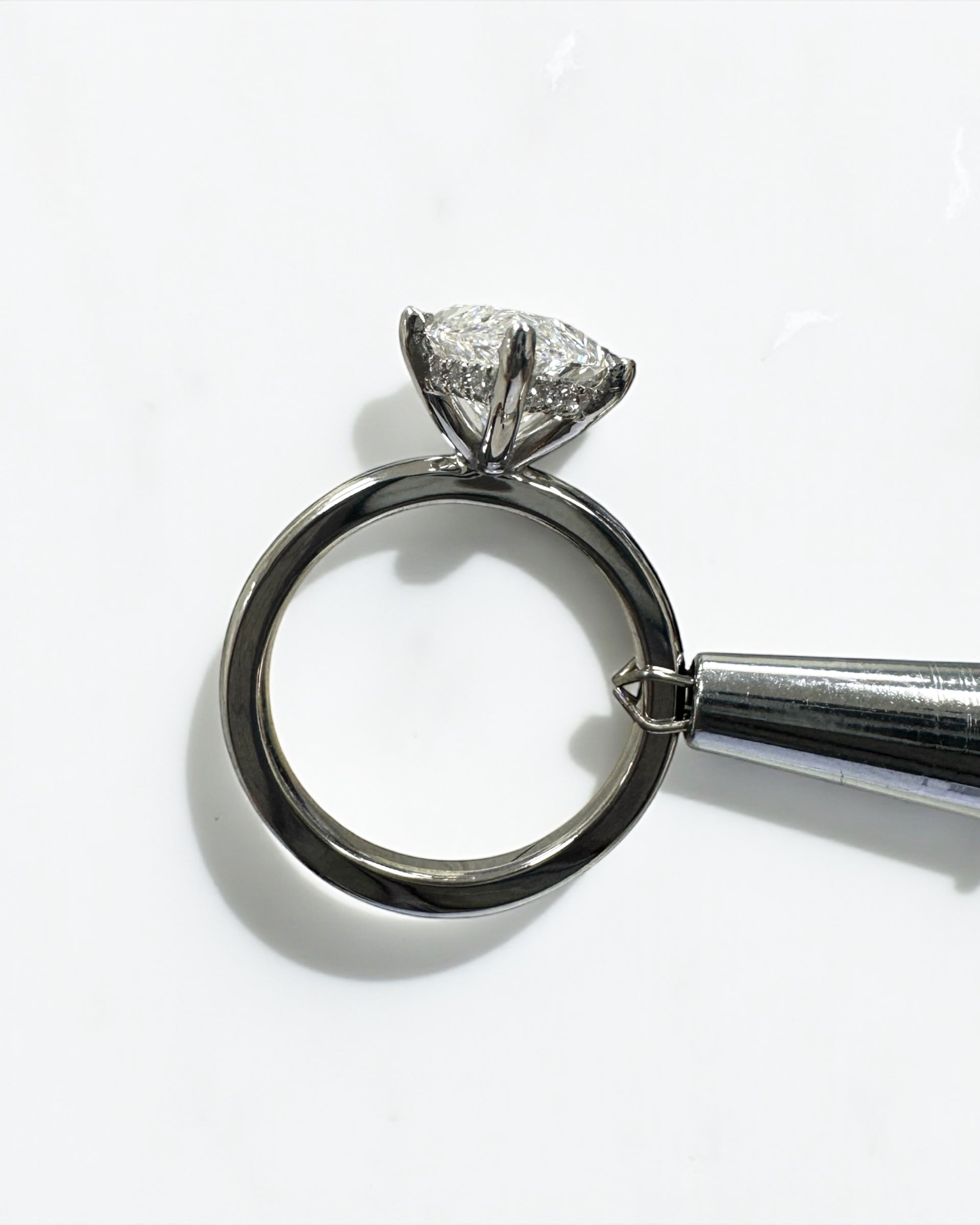 3.50ct marquise cut lab grown diamond engagement ring with hidden halo and floating head in plain band, handcrafted in London by Layla Diamonds, in platinum