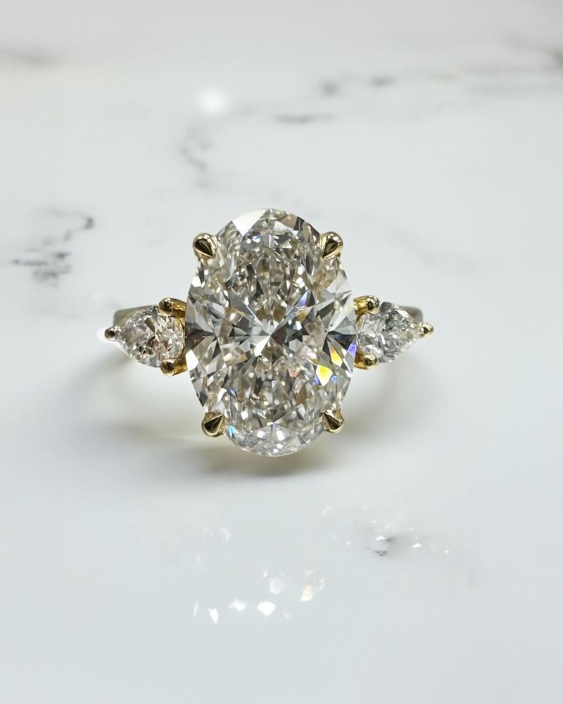 3.50ct Oval Cut Lab grown diamonds with Pear cut diamond trilogy engagement ring 18kt yellow gold 