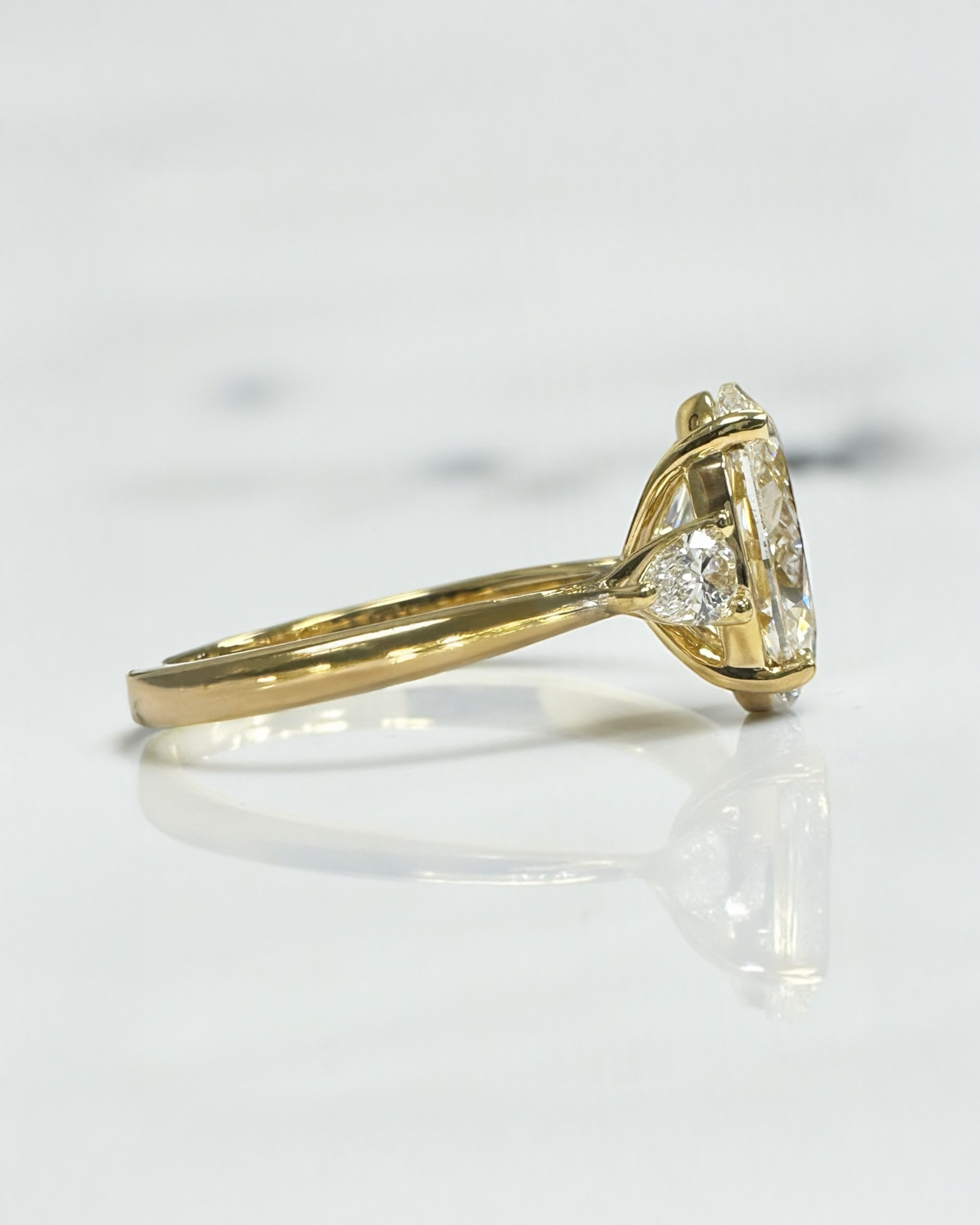 3.50ct Oval Cut Lab grown diamonds with Pear cut diamond trilogy engagement ring 18kt yellow gold 