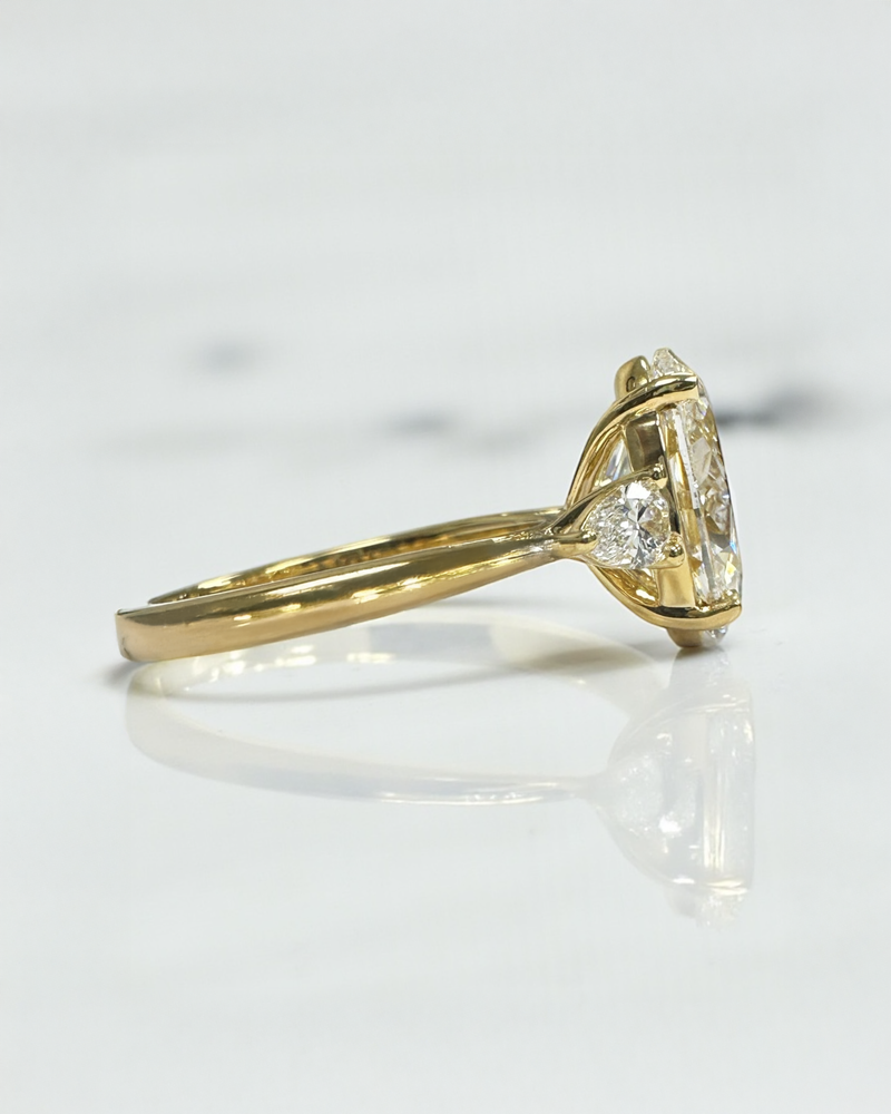 3.50ct Oval Cut Lab grown diamonds with Pear cut diamond trilogy engagement ring 18kt yellow gold 