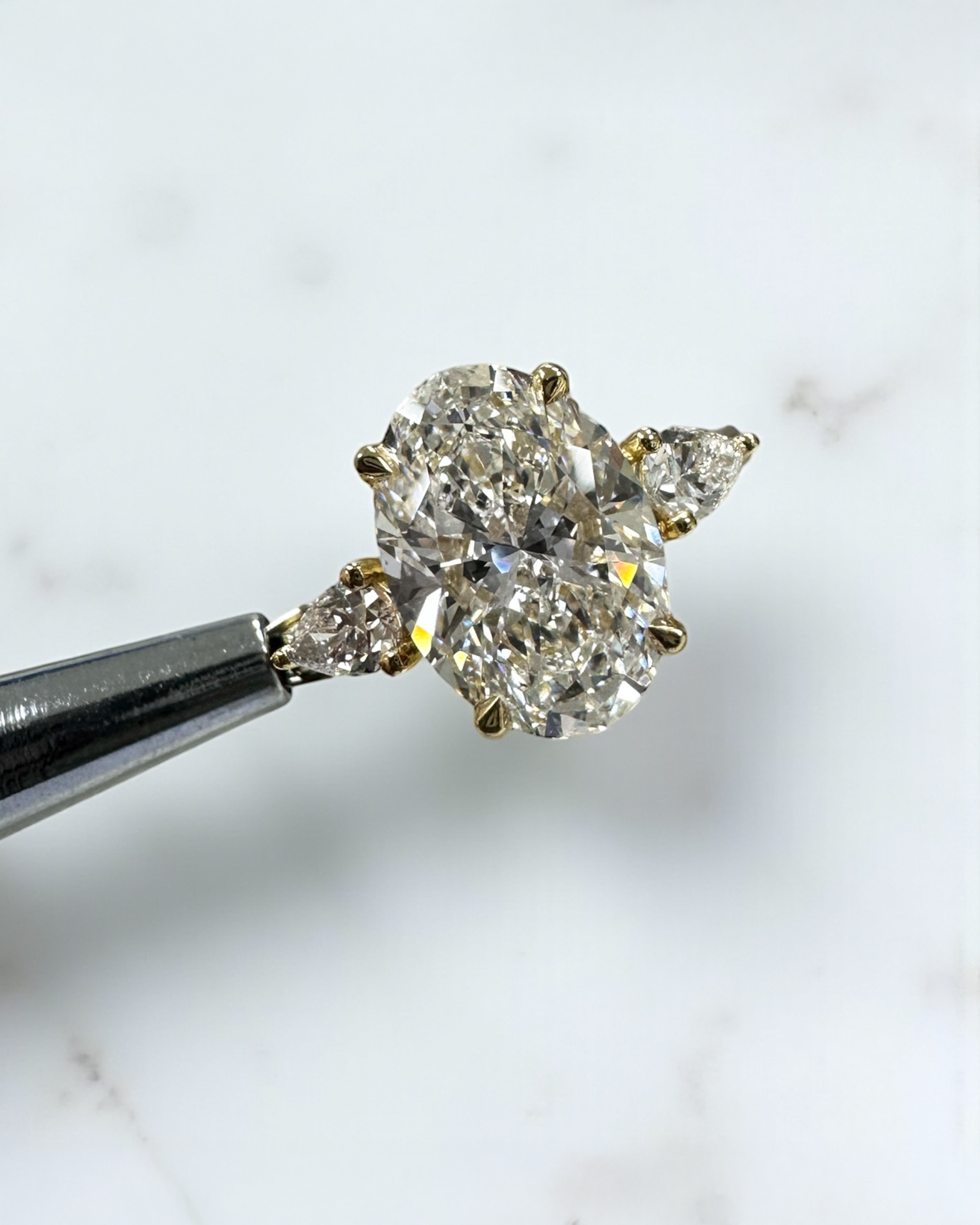 3.50ct Oval Cut Lab grown diamonds with Pear cut diamond trilogy engagement ring 18kt yellow gold 
