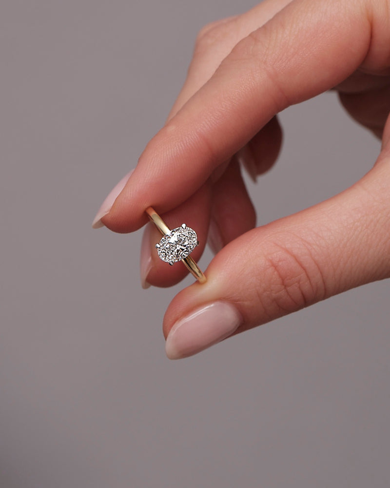 1.25ct oval cut lab grown diamond hidden halo solitaire engagement ring with platinum head by Layla Diamonds.