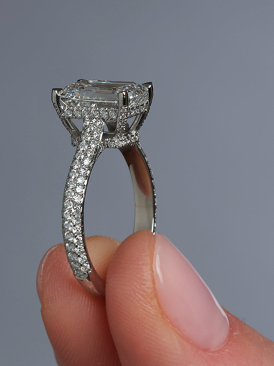  3ct Emerald Cut Lab-Grown Diamond Ring with a 3D Diamond Band and Hidden Halo