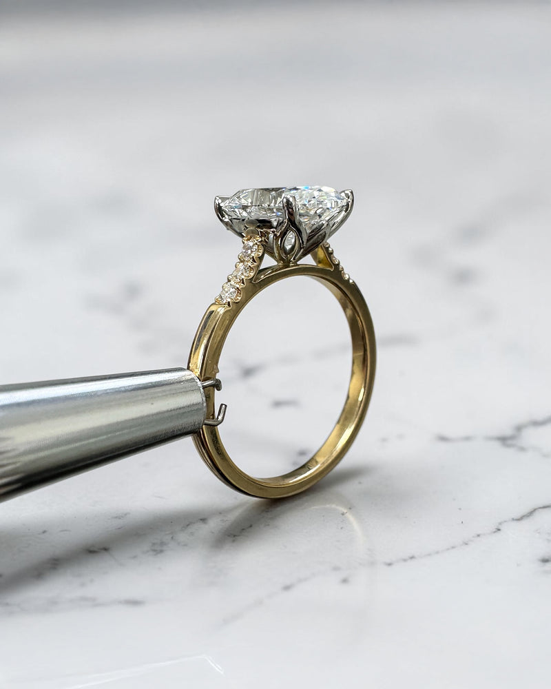3ct oval Oval Cathedral Set Ring
lab-grown diamond engagement ring with a cathedral setting, partial pavé diamond band and diamond wrap around hidden halo. Handmade in London and available in platinum or 18kt yellow gold.
