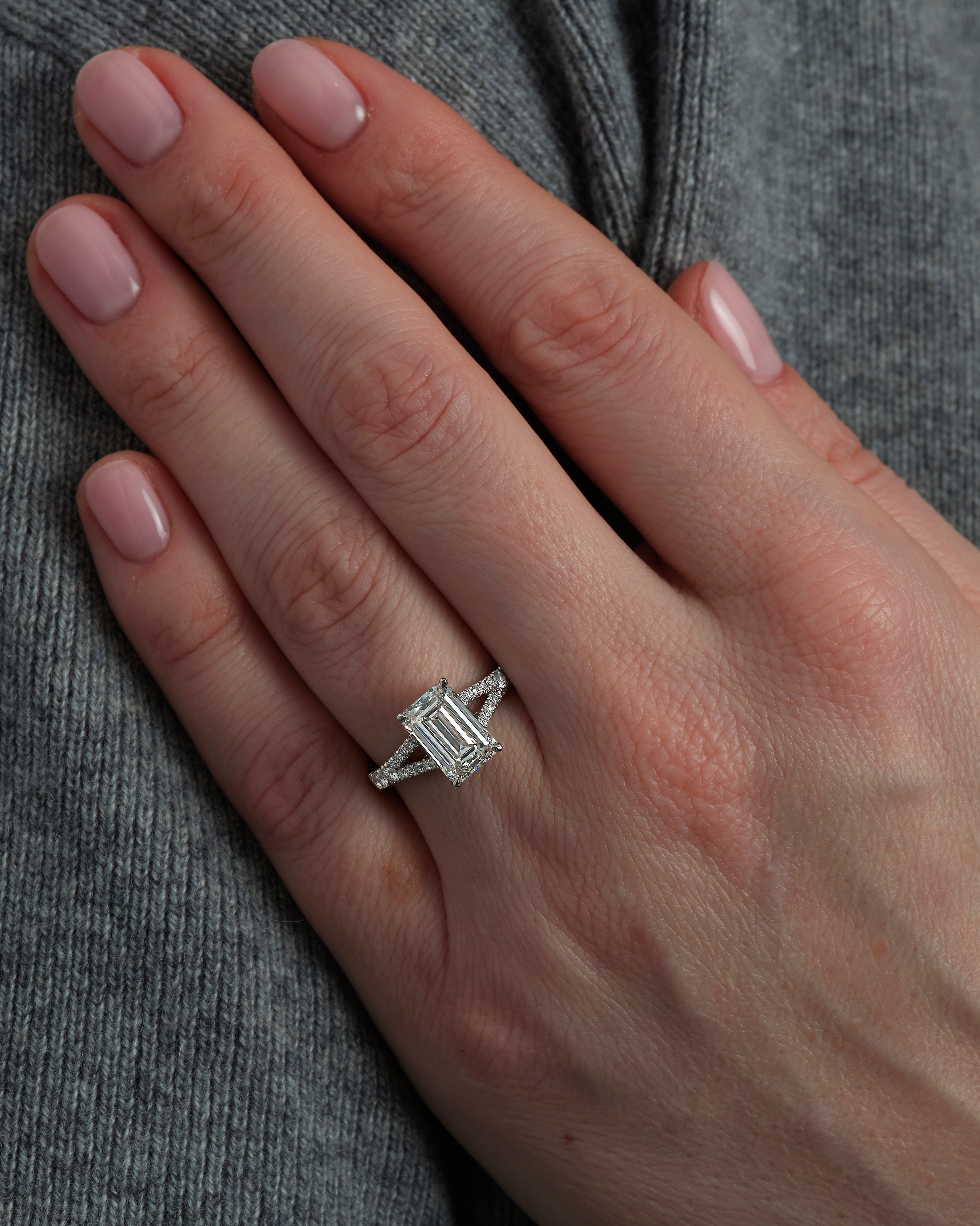 3ct Emerald Cut Split Shank Engagement Ring on hand