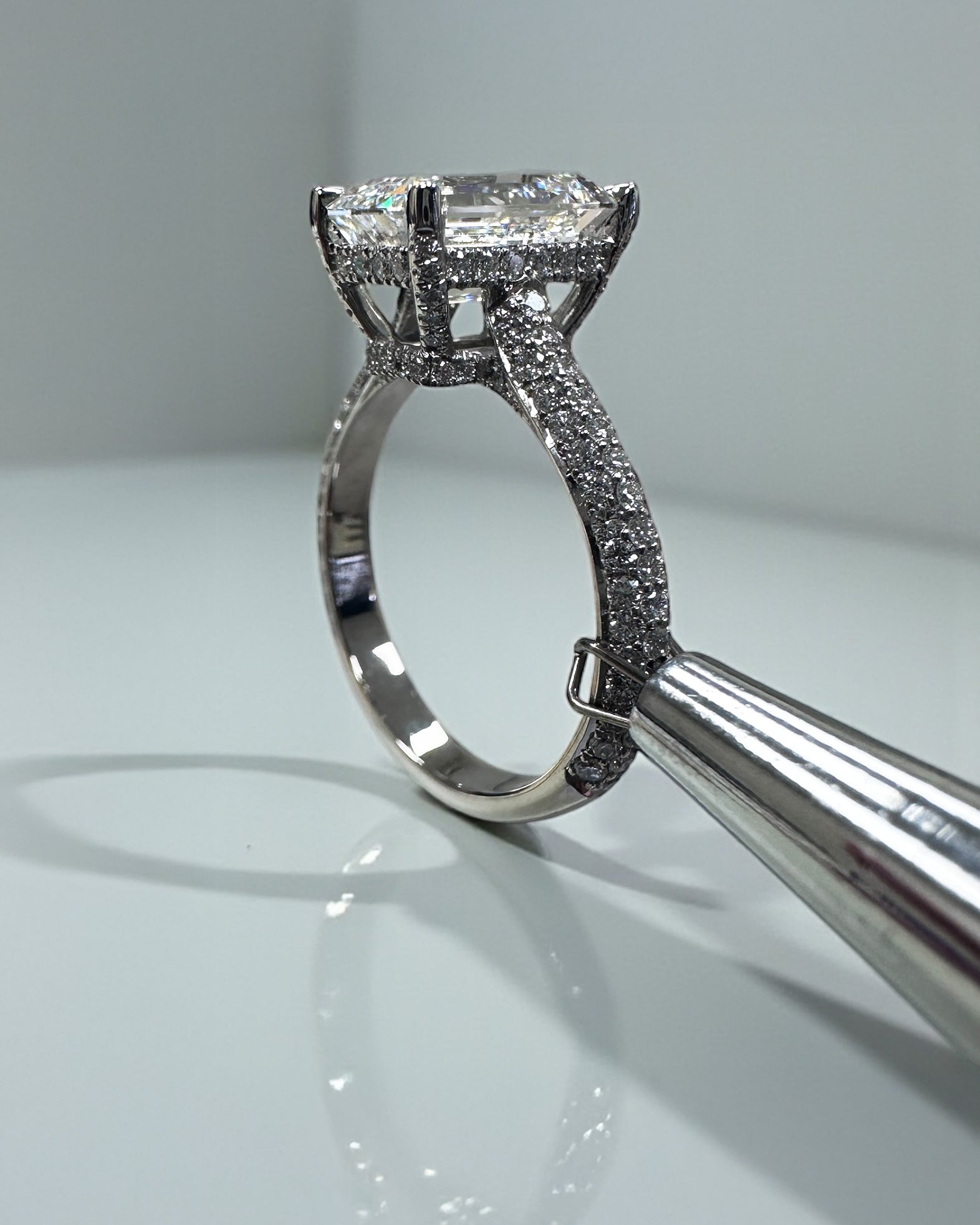 3ct Emerald Cut Lab grown diamond 3d band cathedral setting hidden halo engagement ring, made in London by Layla Diamonds, platinum or 18kt gold