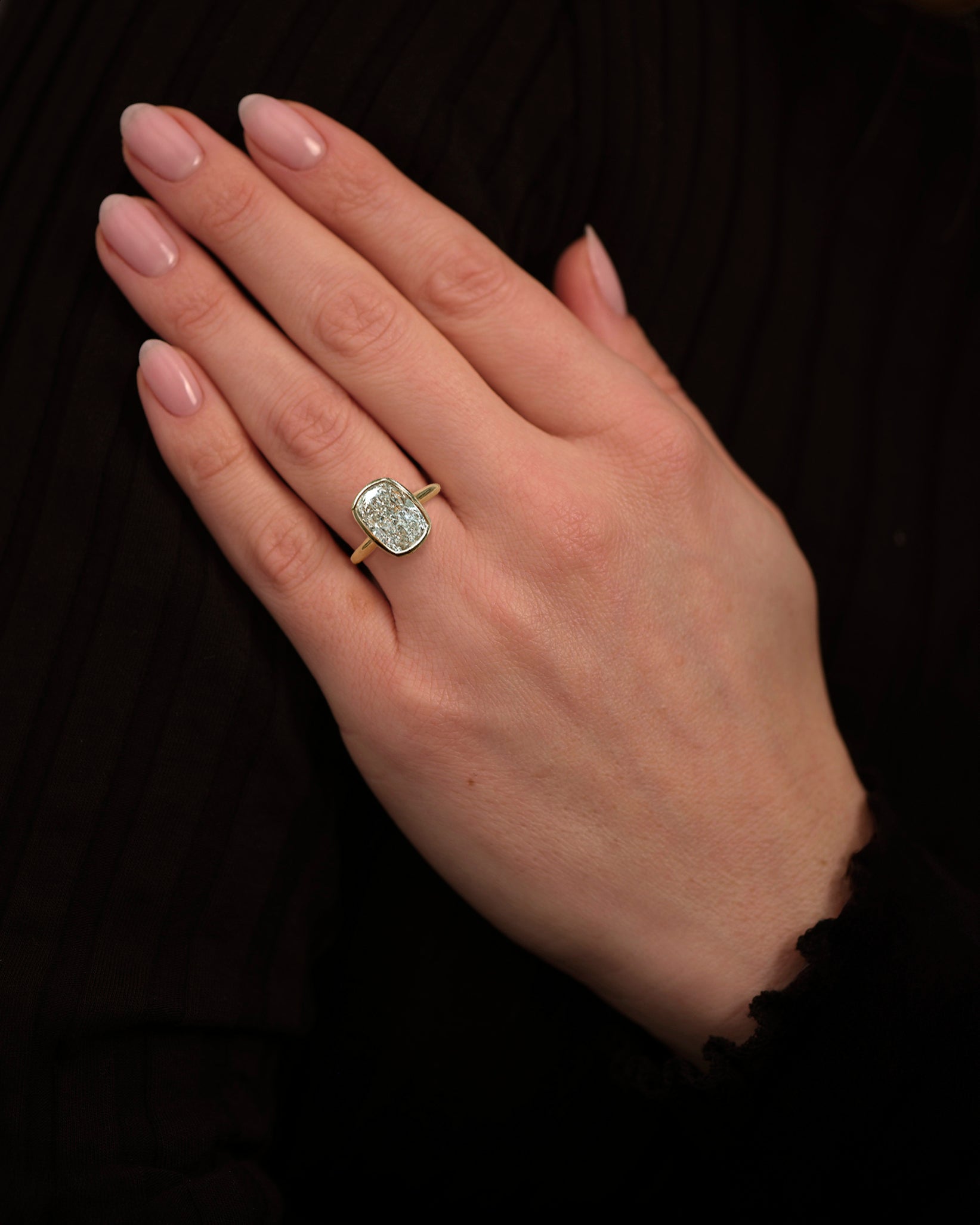 3ct elongated cushion cute lab grown diamond bezel setting plain band solitaire engagement ring, 18kt yellow gold on hand