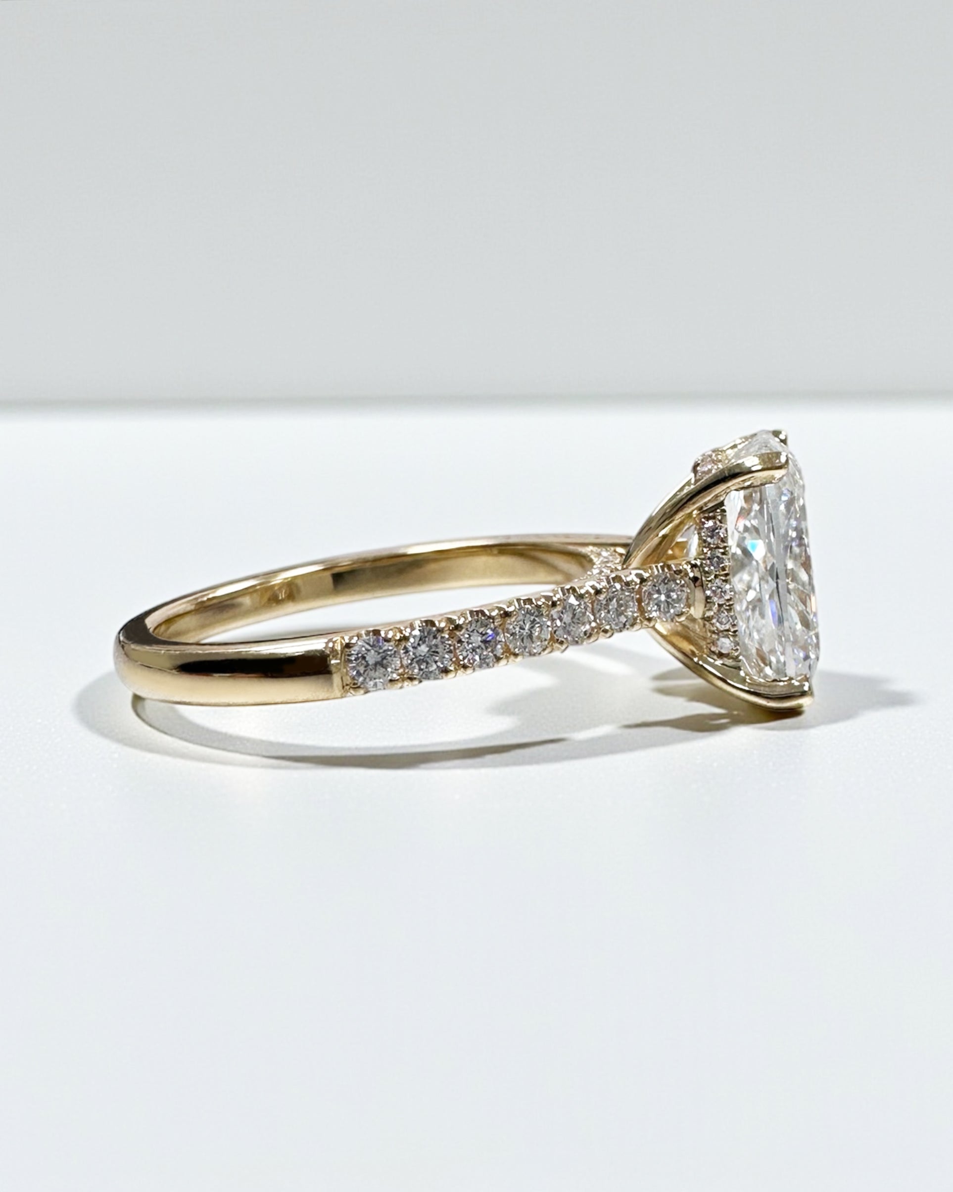 3ct elongated cushion cut lab grown diamond cathedral engagement ring hidden halo 