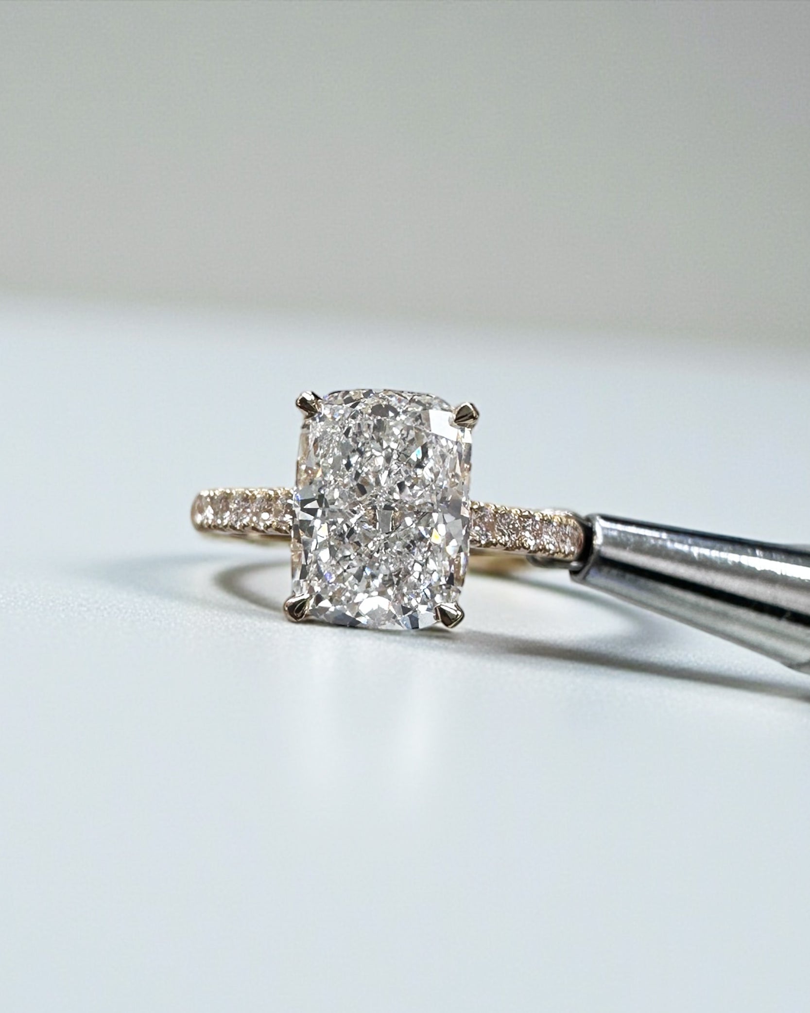 3ct elongated cushion cut lab grown diamond cathedral engagement ring hidden halo 