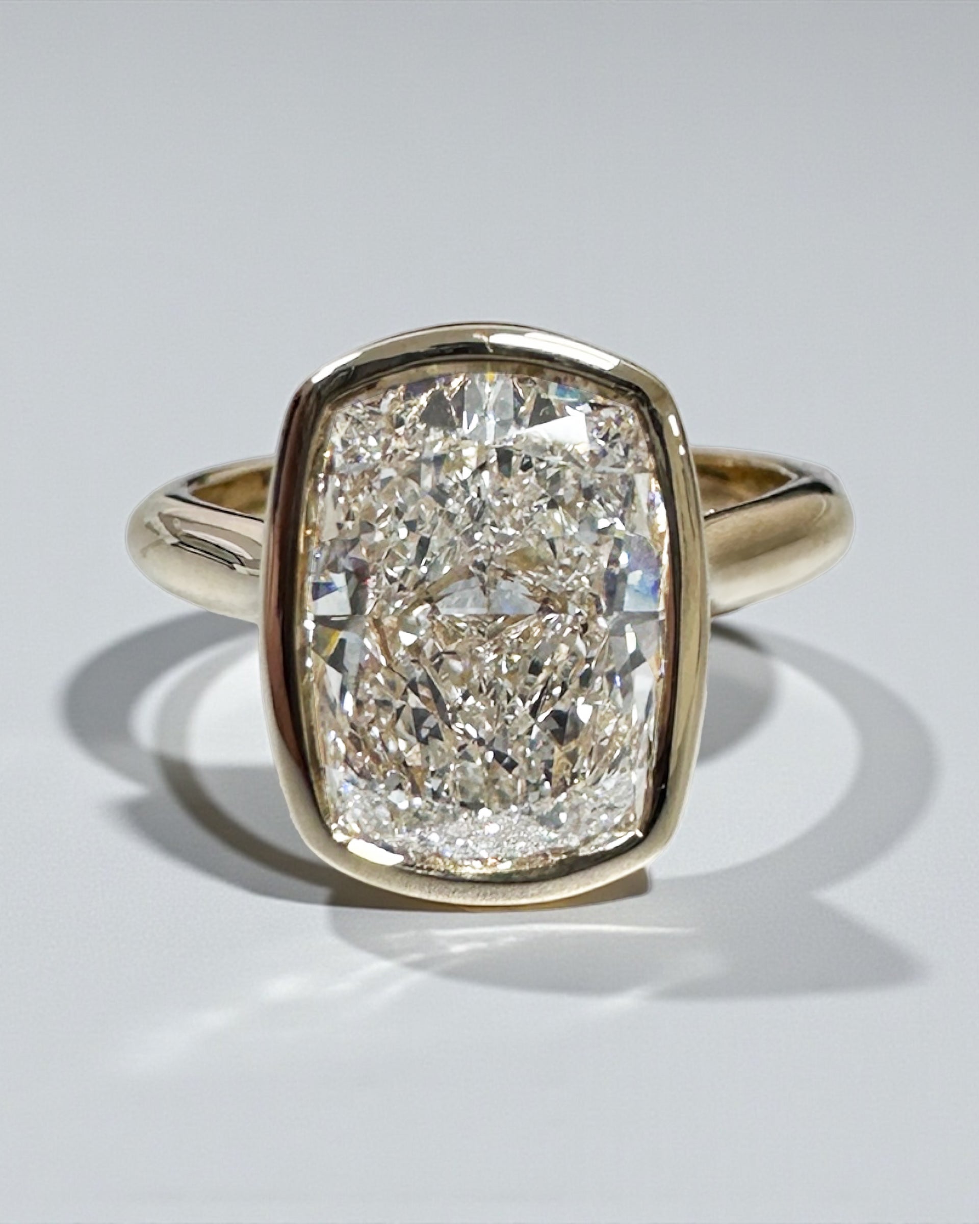 3ct elongated cushion cute lab grown diamond bezel setting plain band solitaire engagement ring, 18kt yellow gold