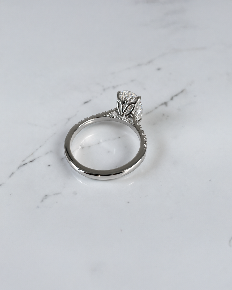3ct oval cut lab grown diamond engagement platinum ring with lotus head setting, cathedral pavé diamond band and hidden diamond bridge, luxury solitaire ring  handcrafted in London