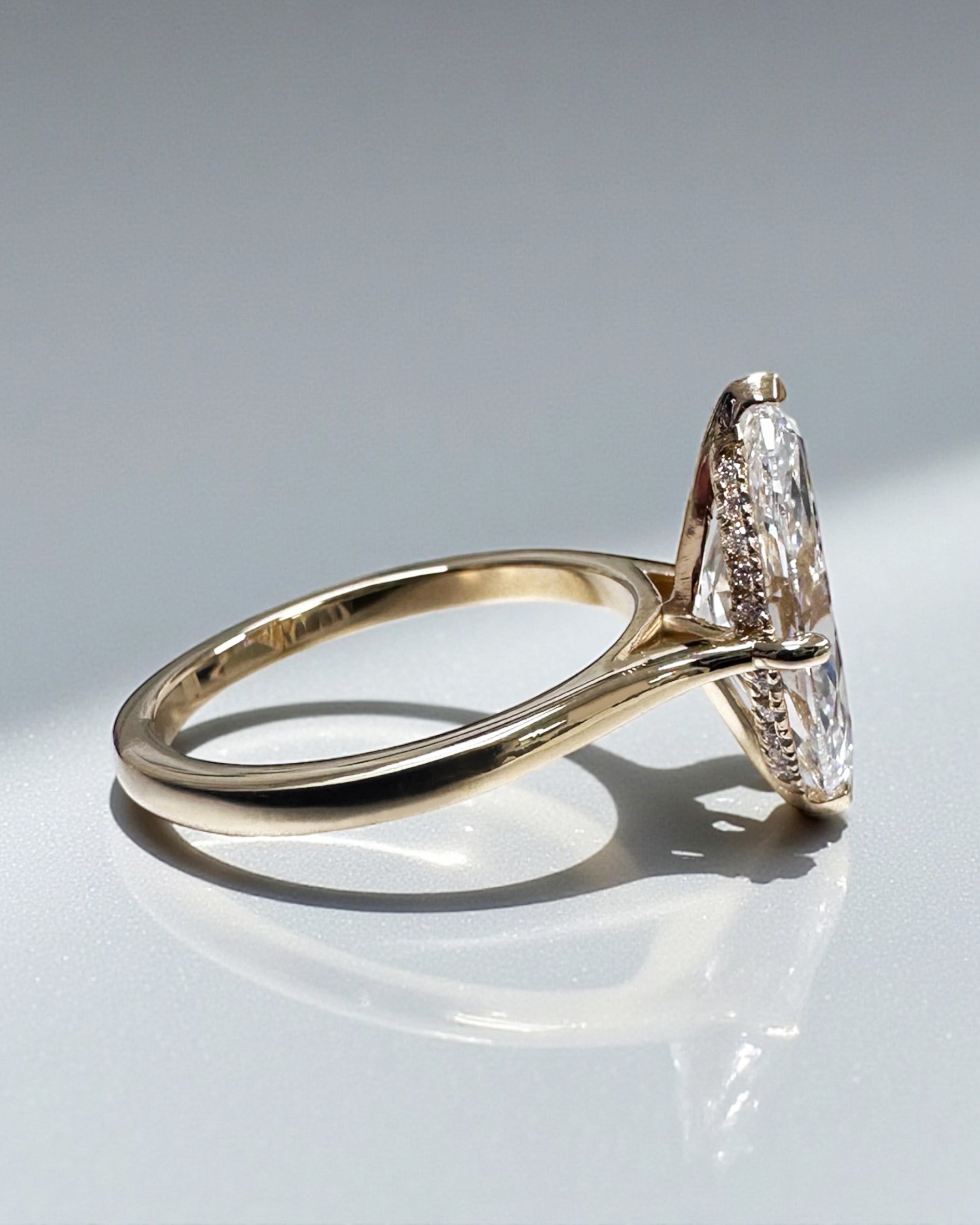 3ct Marquise Cut lab grown Diamond set in a Tapered plain Band Solitaire with a diamond Hidden Halo engagement ring
