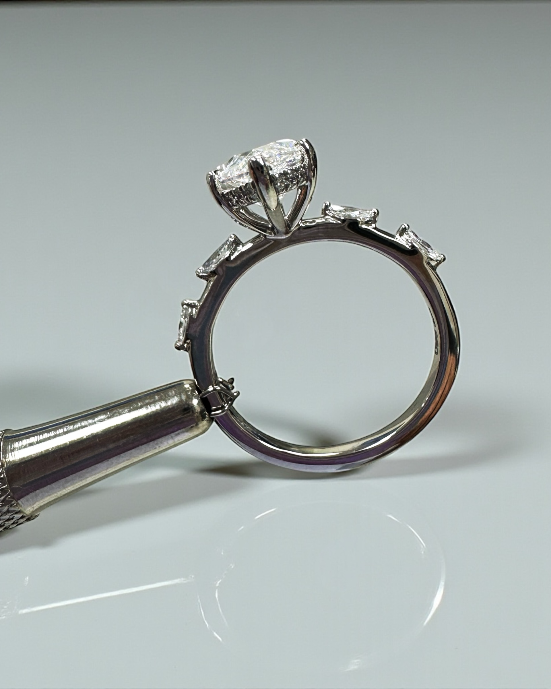 3ct marquise cut lab grown diamond set on a spaced marquise cut band engagement ring platinum 18kt gold