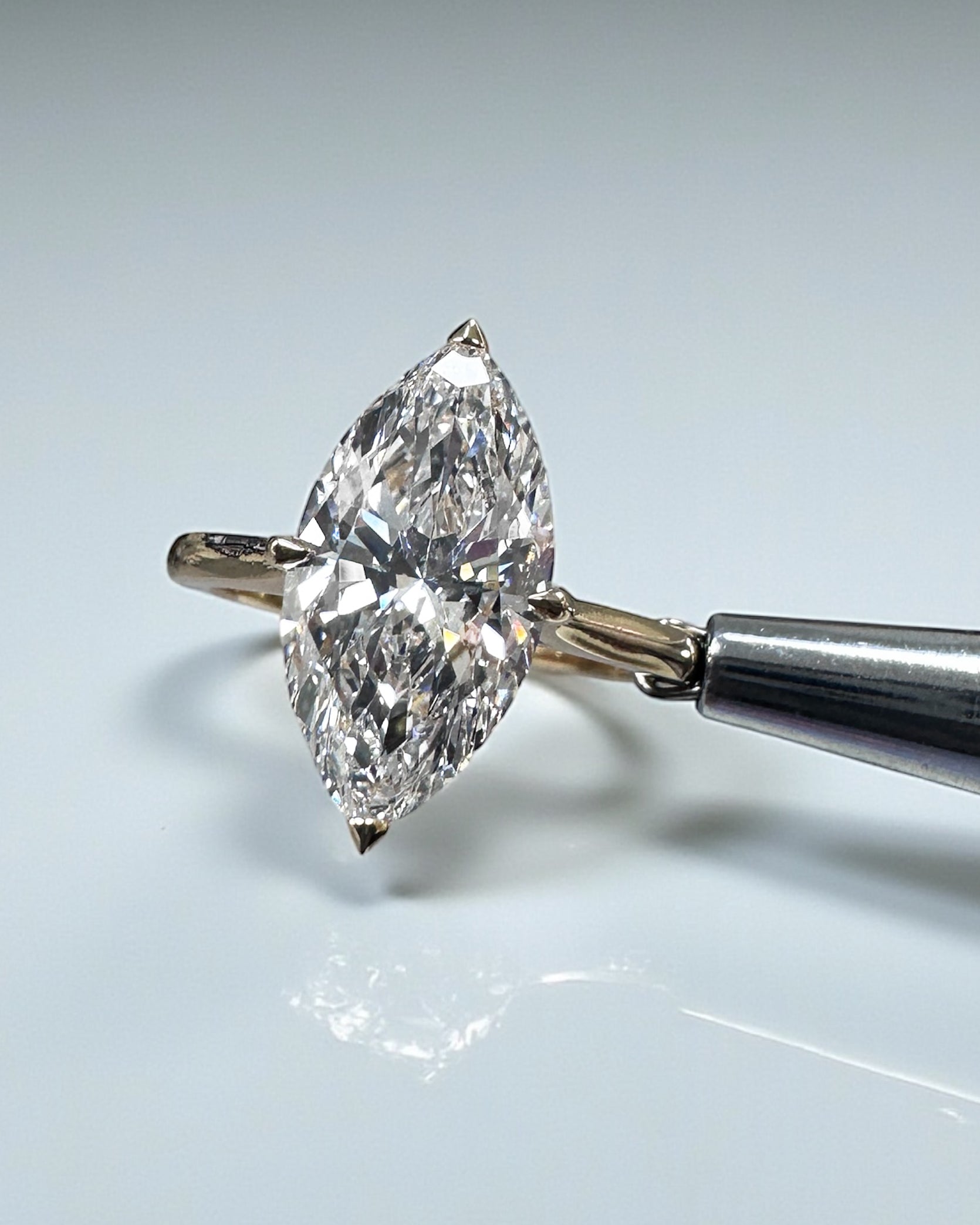 3ct Marquise Cut lab grown Diamond set in a Tapered plain Band Solitaire with a diamond Hidden Halo engagement ring