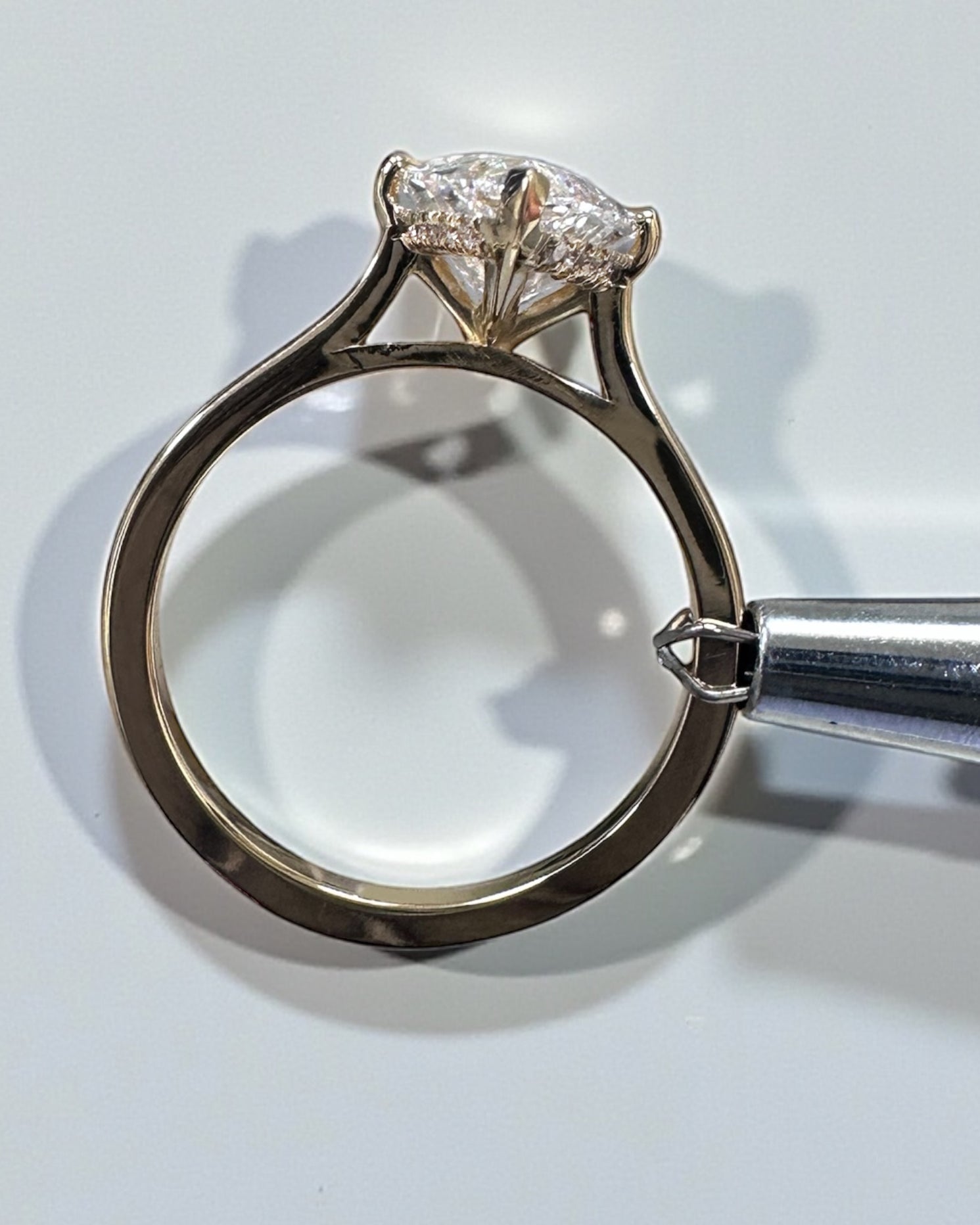 3ct Marquise Cut lab grown Diamond set in a Tapered plain Band Solitaire with a diamond Hidden Halo engagement ring