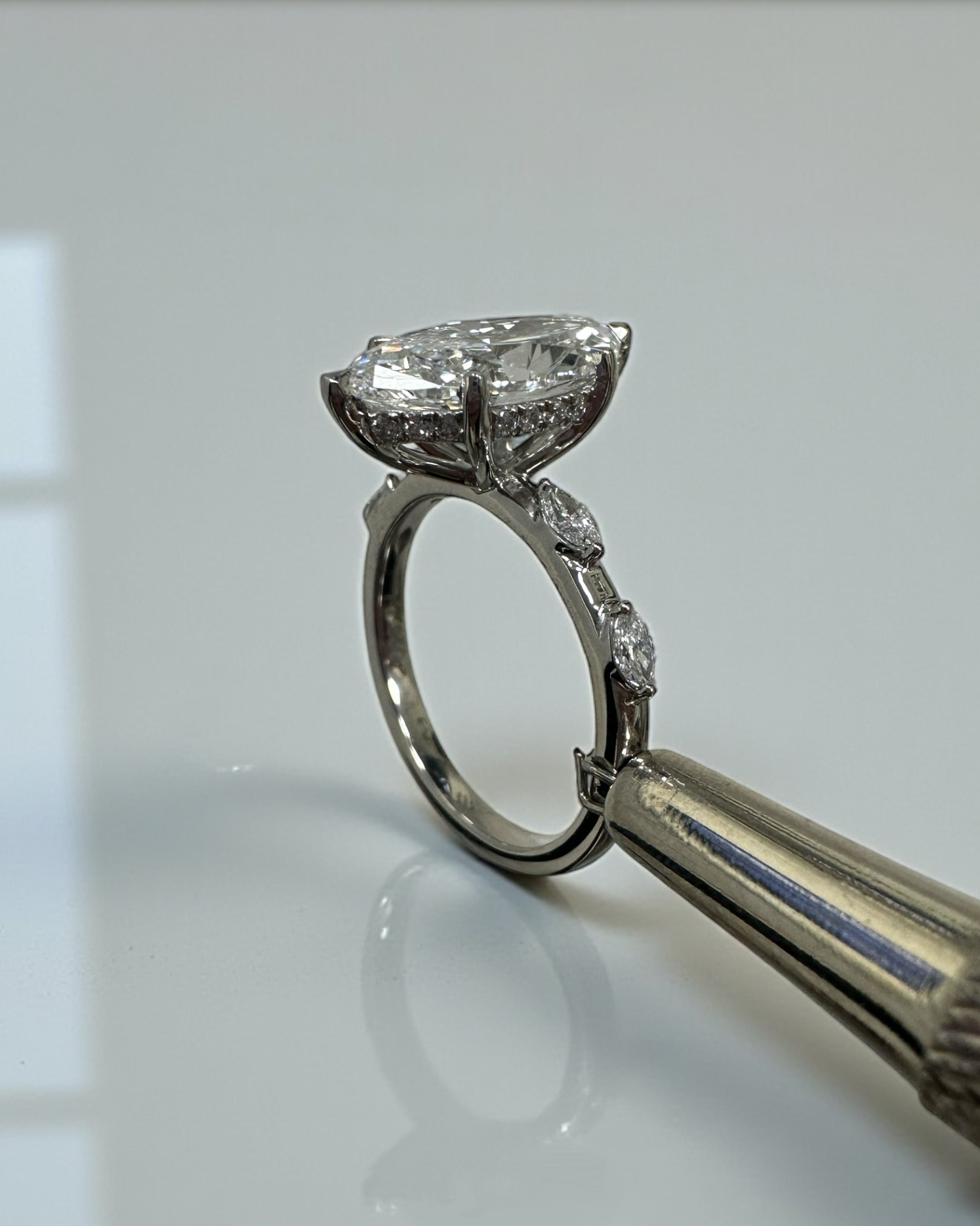 3ct marquise cut lab grown diamond set on a spaced marquise cut band engagement ring platinum 18kt gold