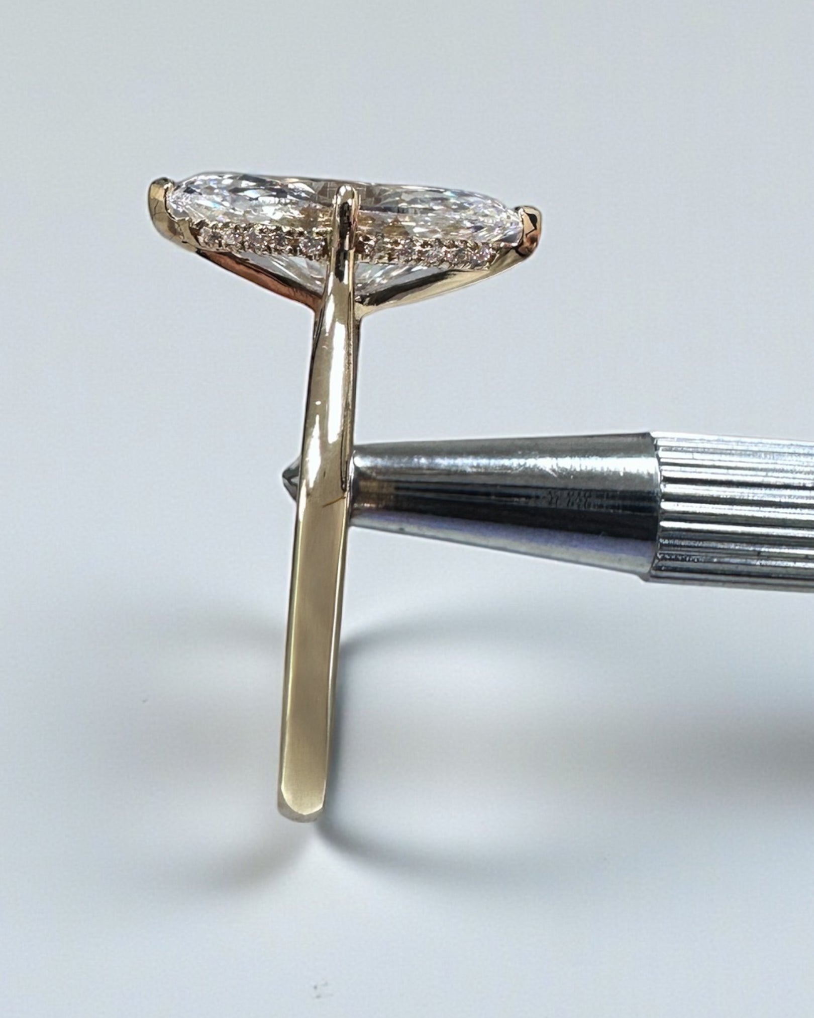 3ct Marquise Cut lab grown Diamond set in a Tapered plain Band Solitaire with a diamond Hidden Halo engagement ring