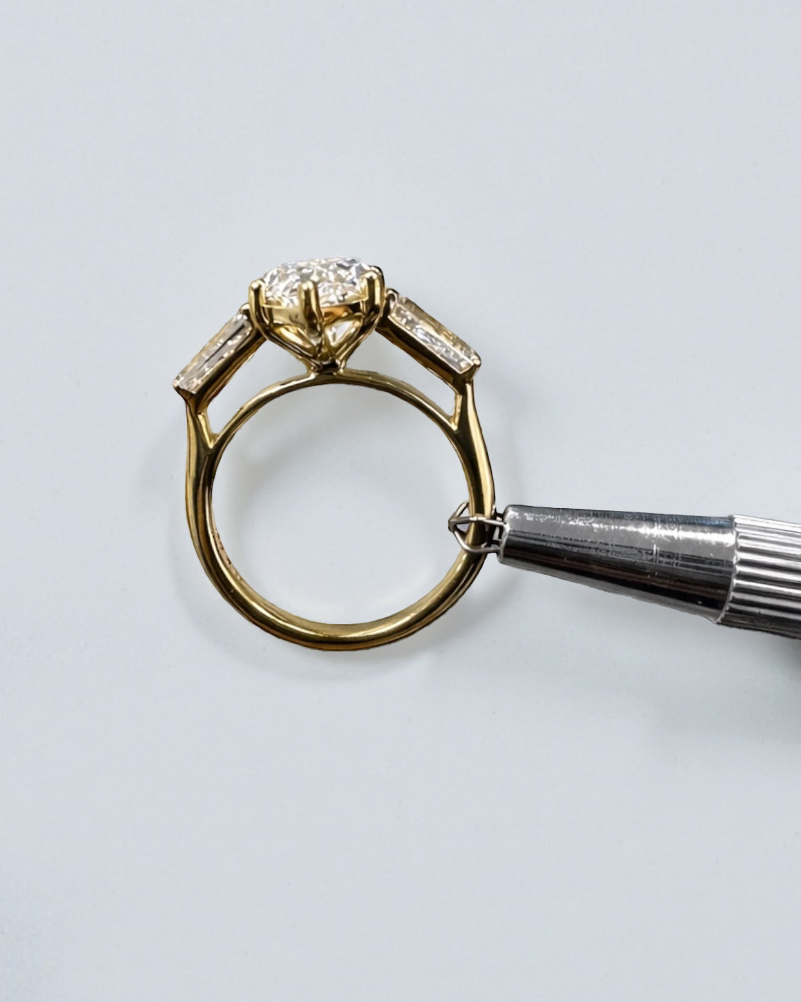 3ct marquise cut lab grown diamond trilogy engagement ring with tapered baguette side diamonds in 18kt yellow gold, total 4ct