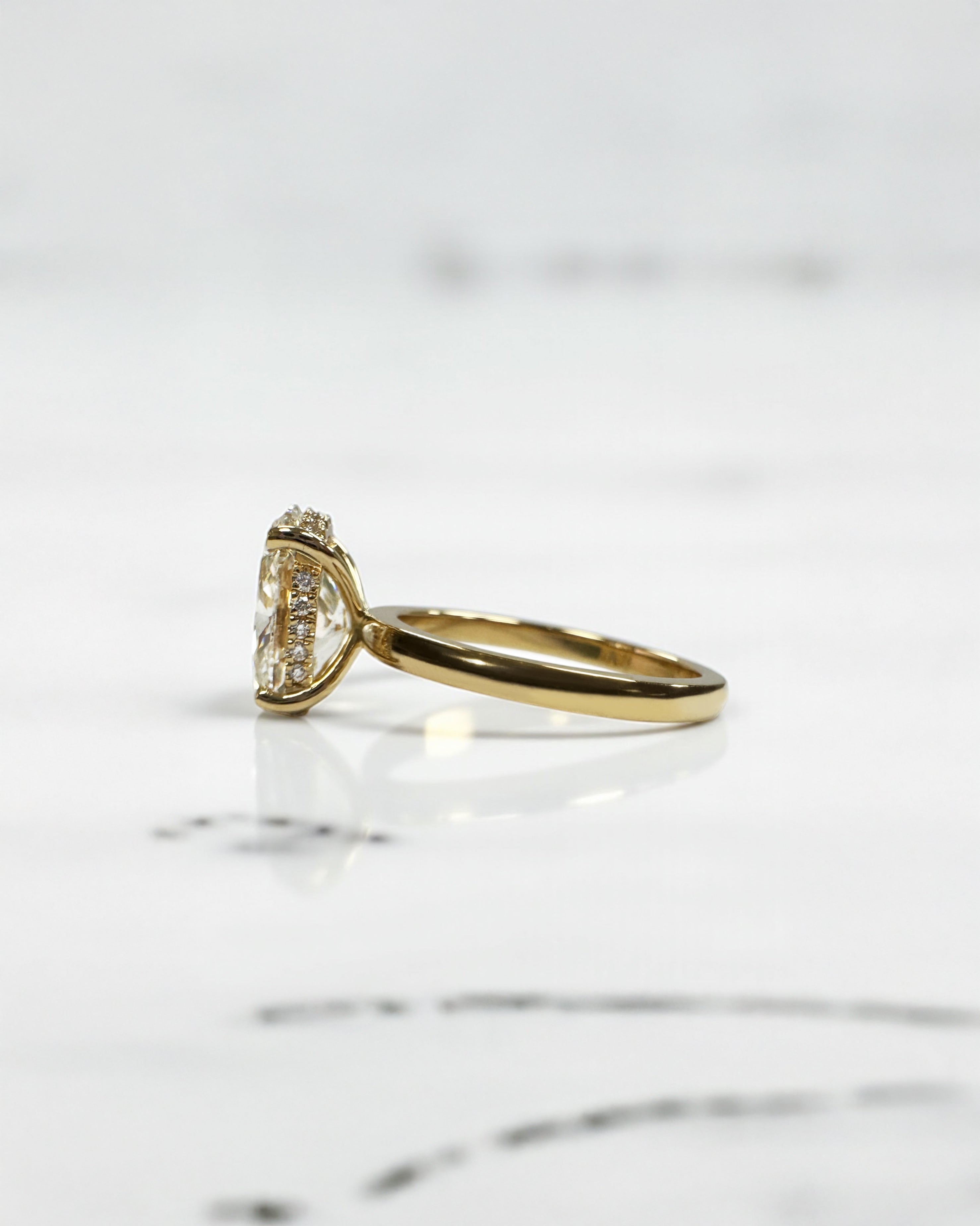 3ct oval lab grown diamond hidden halo solitaire engagement ring in 18kt yellow gold, layla diamonds london