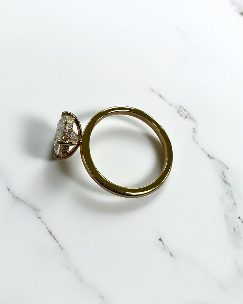 3ct oval lab grown diamond hidden halo solitaire engagement ring in 18kt yellow gold, layla diamonds london