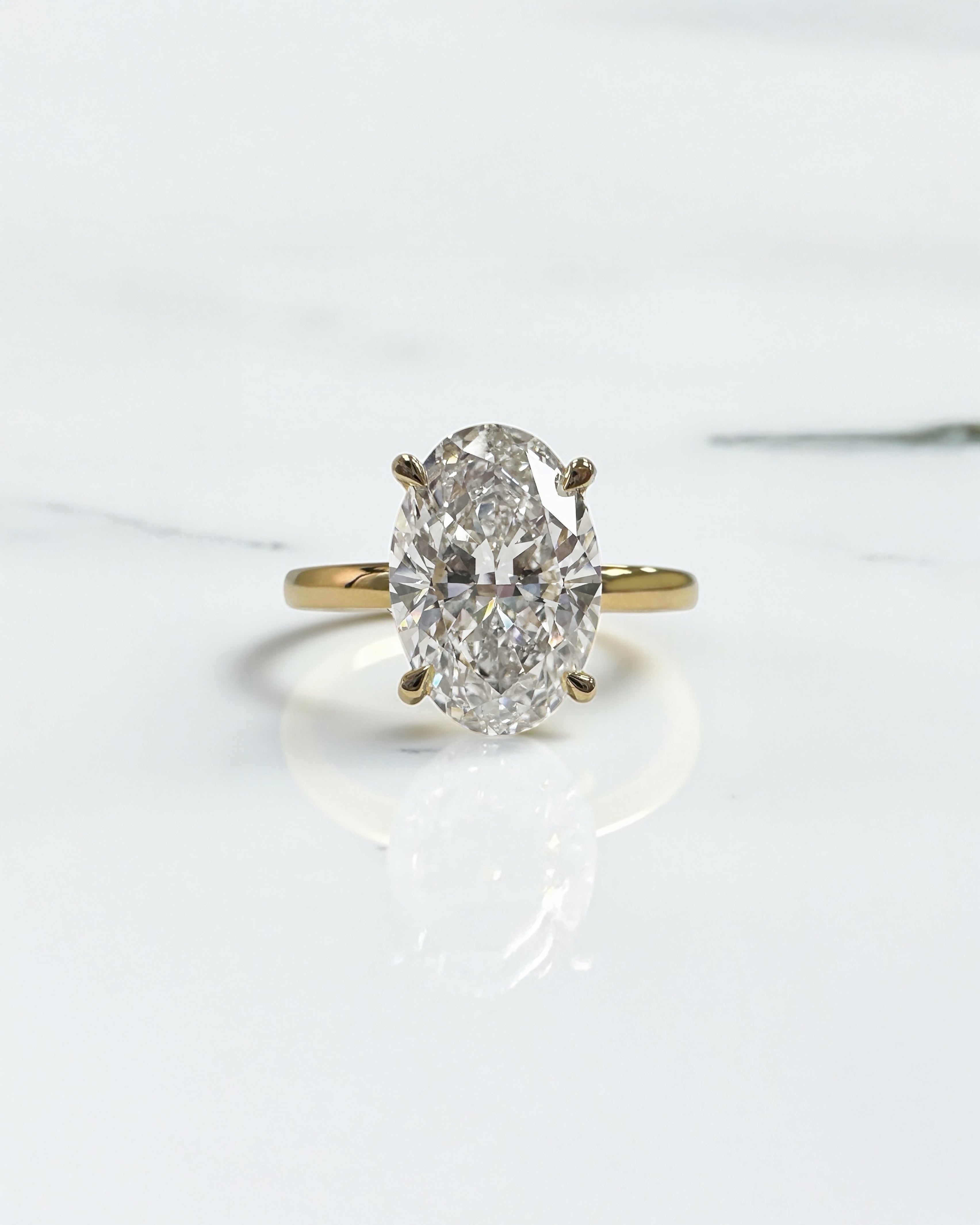 3ct oval lab grown diamond hidden halo solitaire engagement ring in 18kt yellow gold, layla diamonds london