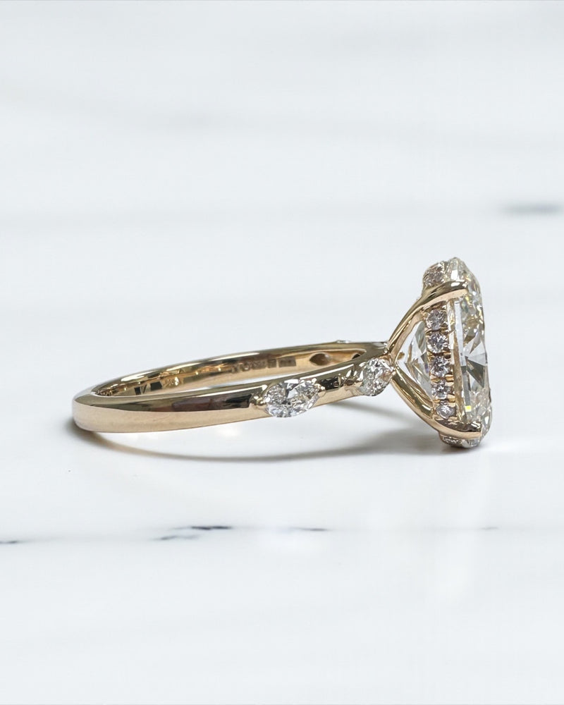 3ct oval cut lab grown diamond marquise spaced band engagement ring, hidden halo 18kt yellow gold made in London by Layla Diamonds