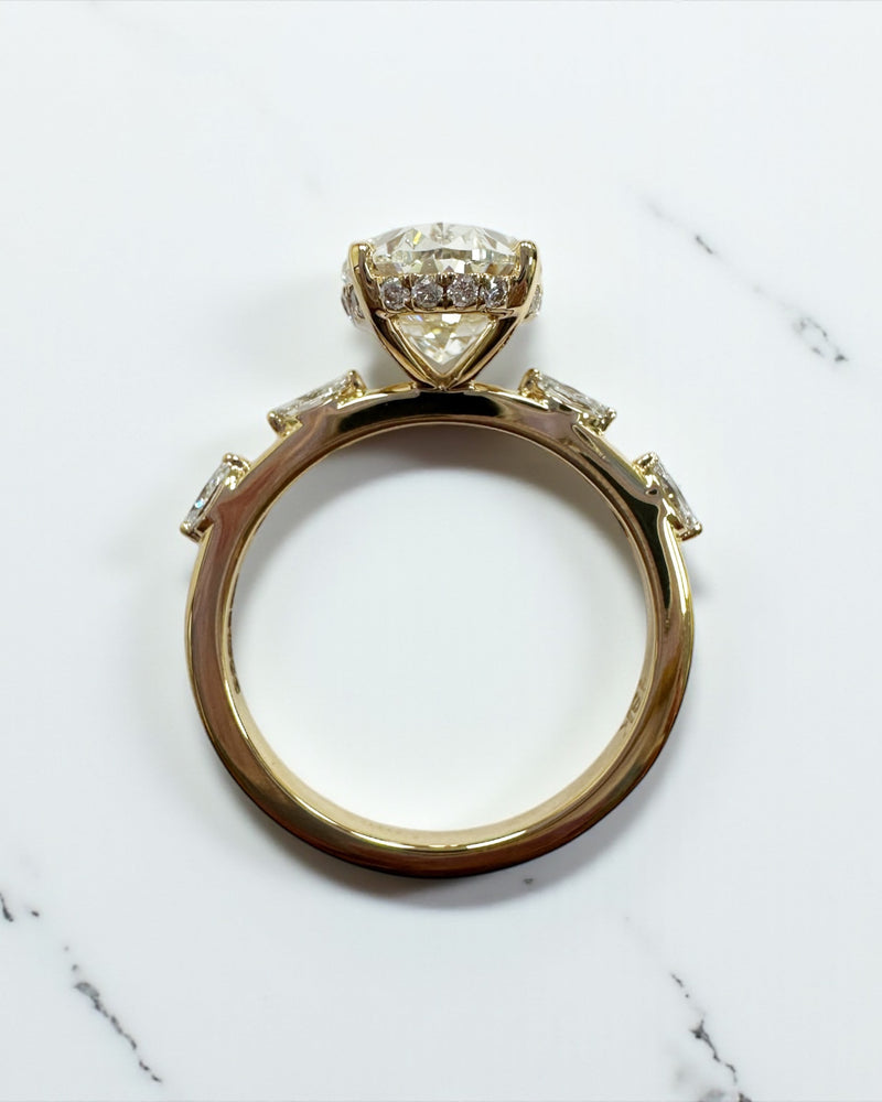 3ct oval cut lab grown diamond marquise spaced band engagement ring, hidden halo 18kt yellow gold made in London by Layla Diamonds