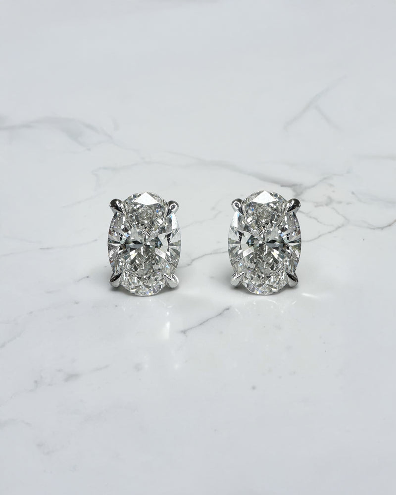 3ct lab grown oval diamond stud earrings featuring two 1.50ct oval brilliant cut diamonds in a classic four prong setting.